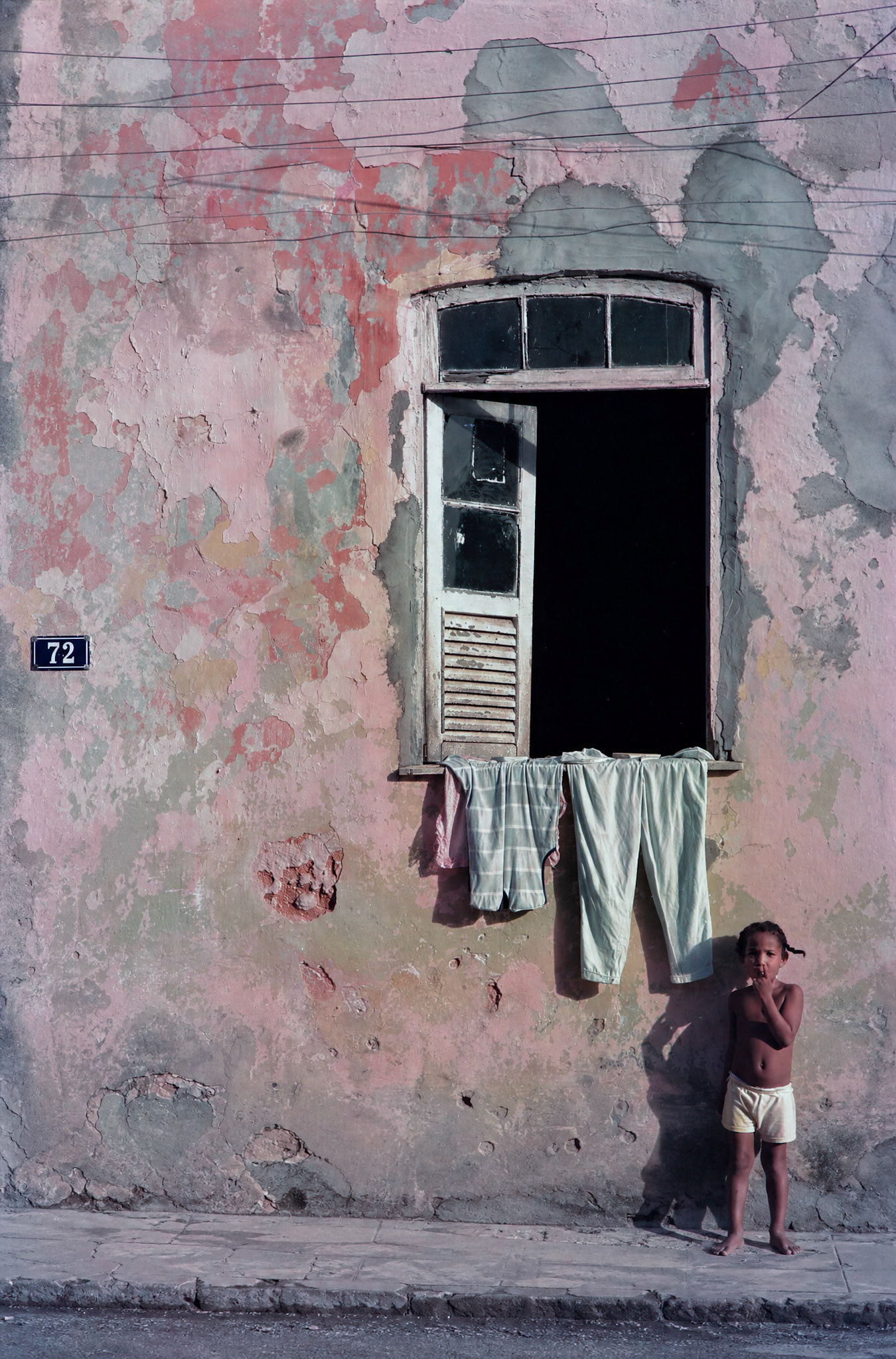 Window with girl, Salvador, Brazil
