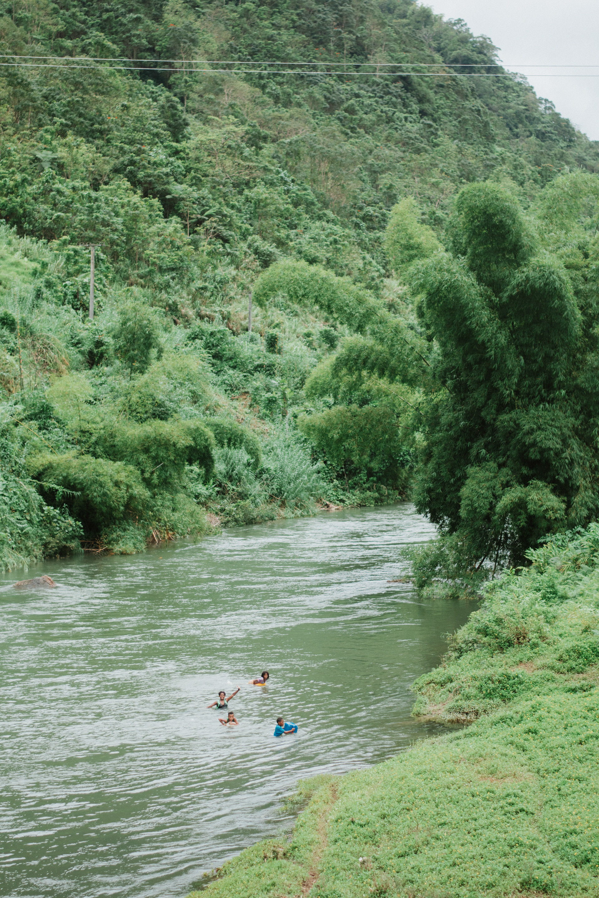 Local children swimming in the river