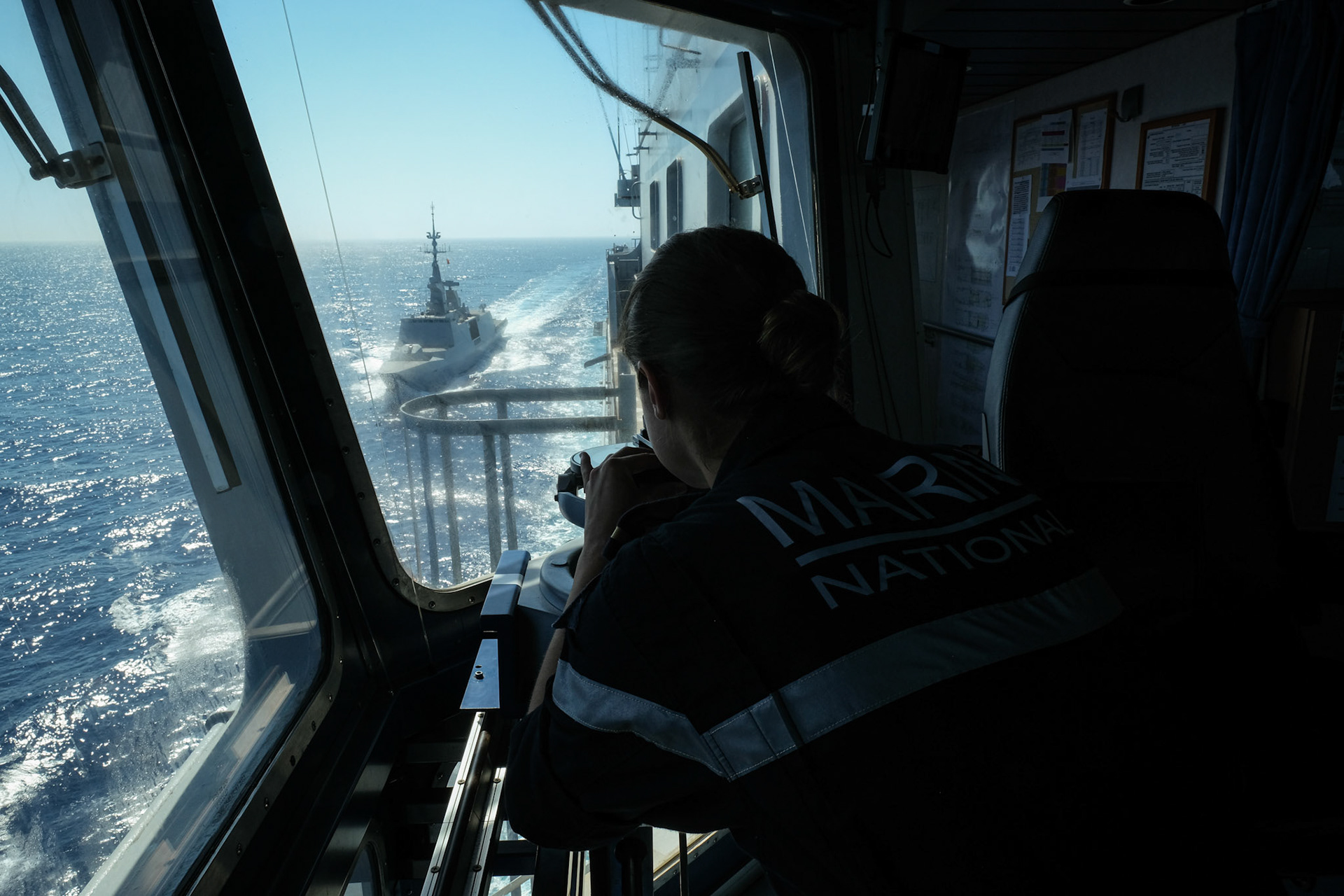 Mediterranean Sea, 2022-07-08. Mathilde, young officer student on French Navy Helicopter carrier Mistral during the Jeanne d’Arc mission, which is a five monthe combined French Navy and Army training and operational voyage to train officers of naval school. Photograph by Fred Marie / Defense Zone.Mer Mediterrannee, 2022-07-08. Mathilde, jeune officier eleve de 23 ans a bord du porte helicoptere Mistral dans le cadre de la mission jeanne d arc, un periple de cinq mois de la marine nationale et de l armee de terre pour former les futurs officiers de l ecole navale. Photographie de Fred Marie / Defense Zone.