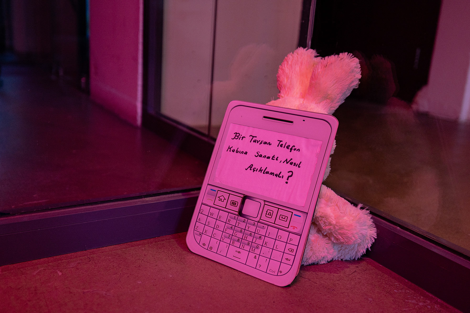 Merve Vural, Your zodiac sign says, Joseph Beuys performance, How to explain art to a rabbit phone case? 2020, plush toy, PVC board, 20 x 15 cm