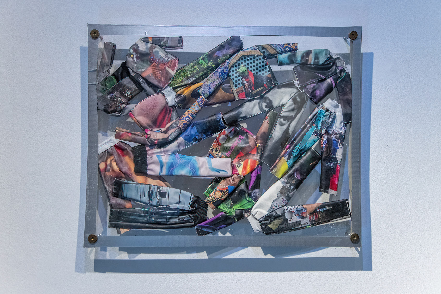 Suits, 2018, tailored prints on fabrics, plexiglass, metal bolts, tape, 49 x 61 x 2 cm