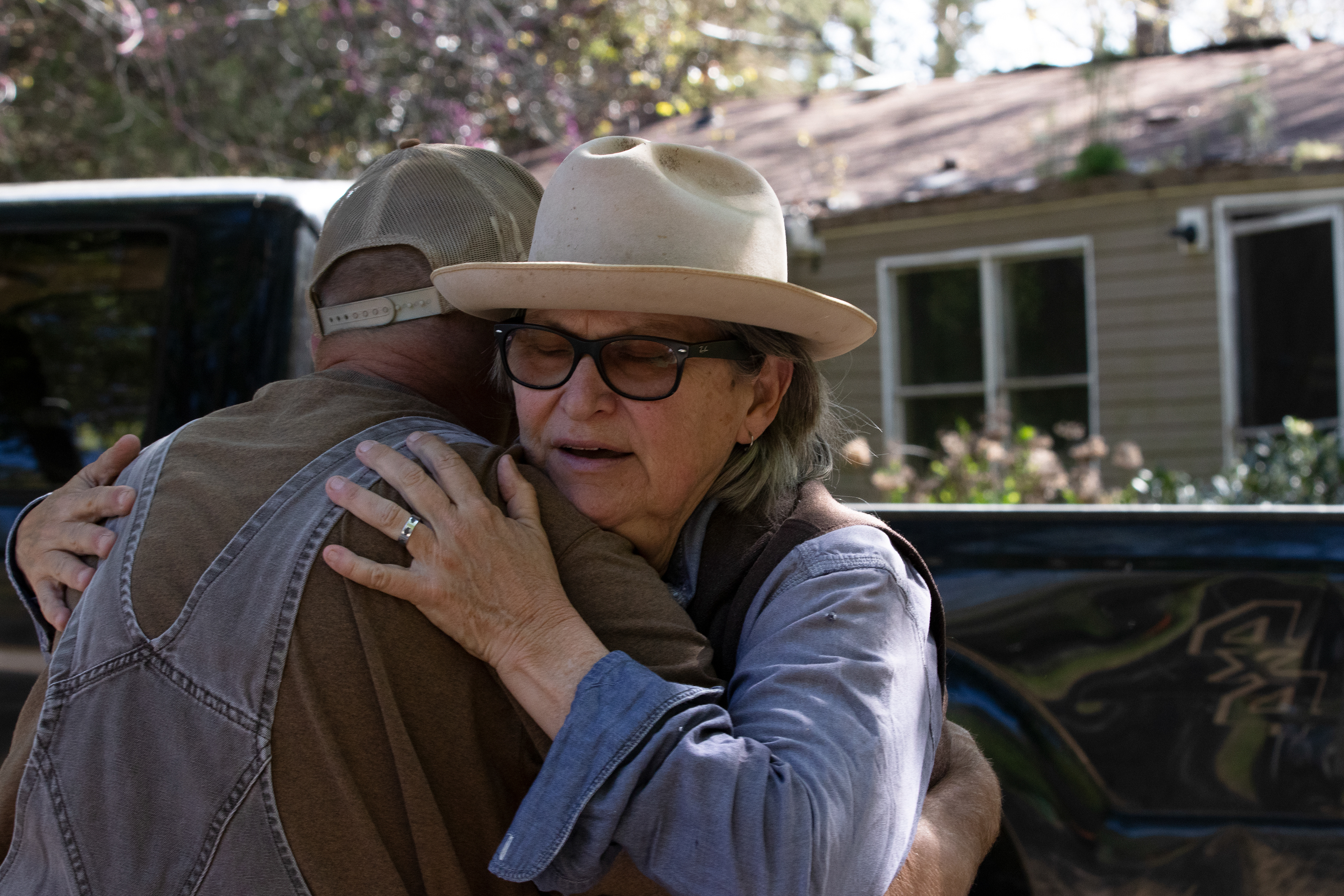 Kat Howkins hugs Eddie Mosko goodbye on April 3, 2022 at Sweet Olive Farm in Winterville, Georgia. Mosko is Cheyenne’s grandpa, and volunteers every Saturday and Sunday at the farm. Mosko loves pigs, so he loves to volunteer at the farm so he can be around them whenever he can. “Pigs got my heart wrapped around their little hooves,” Mosko said.