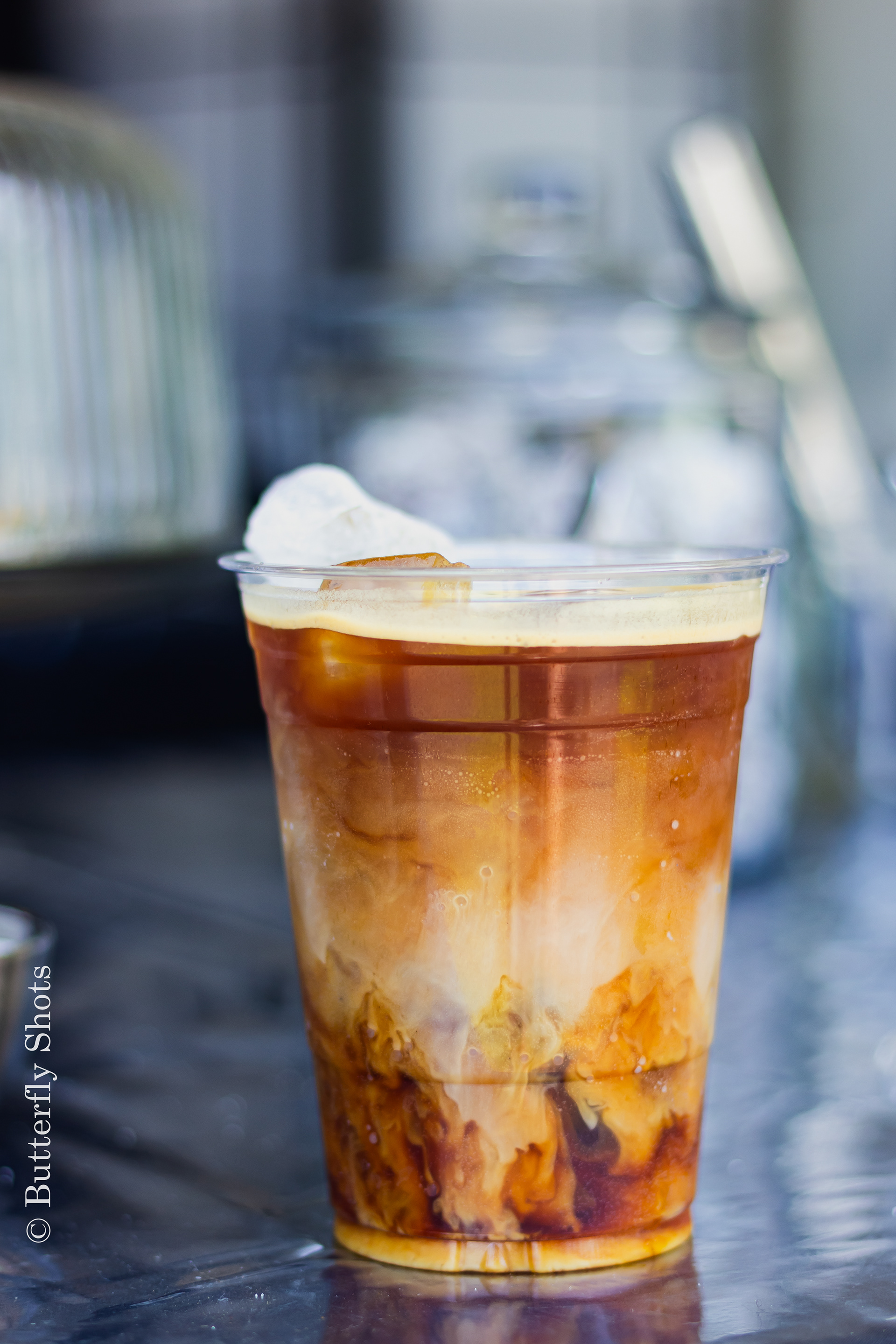 Product photography of a iced coffee on a warm day