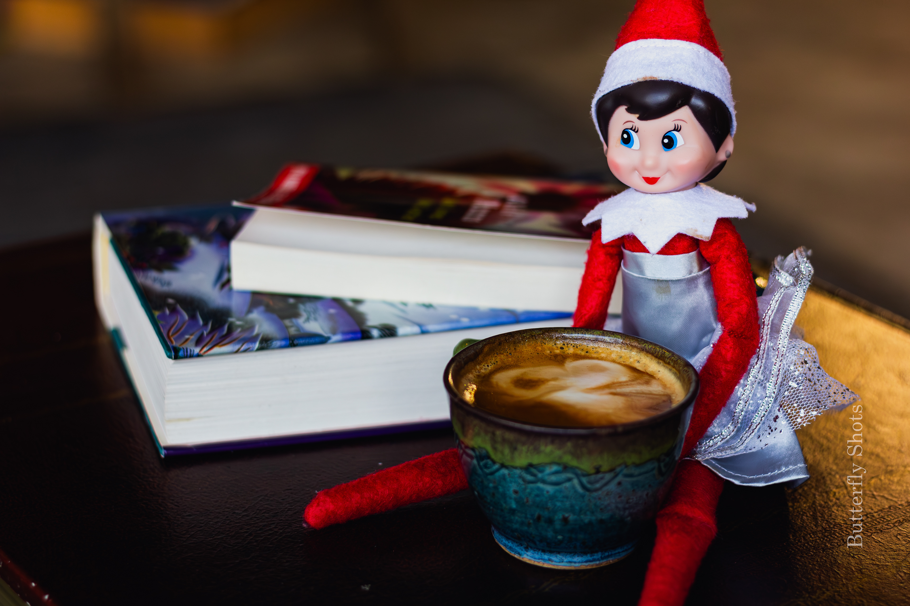 Product photography of a cortado coffee with an elf