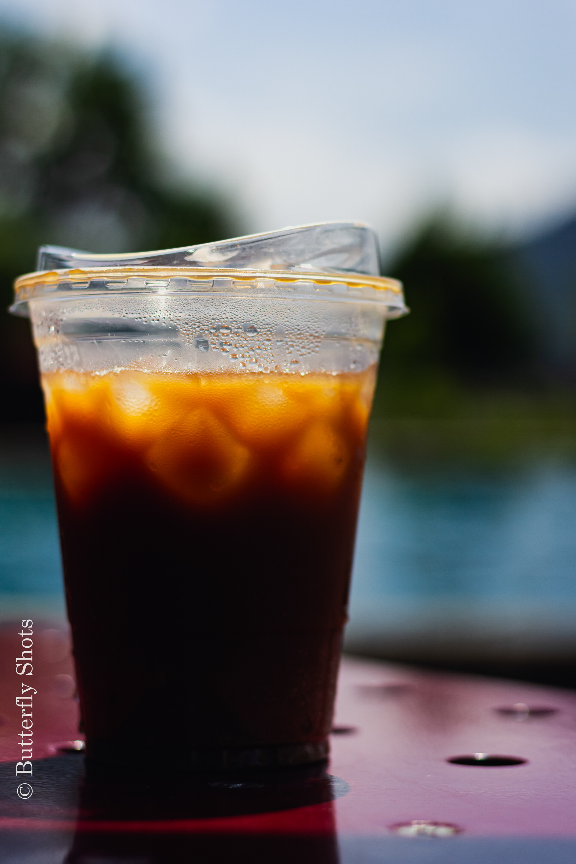 Product photography of a iced coffee on a warm day