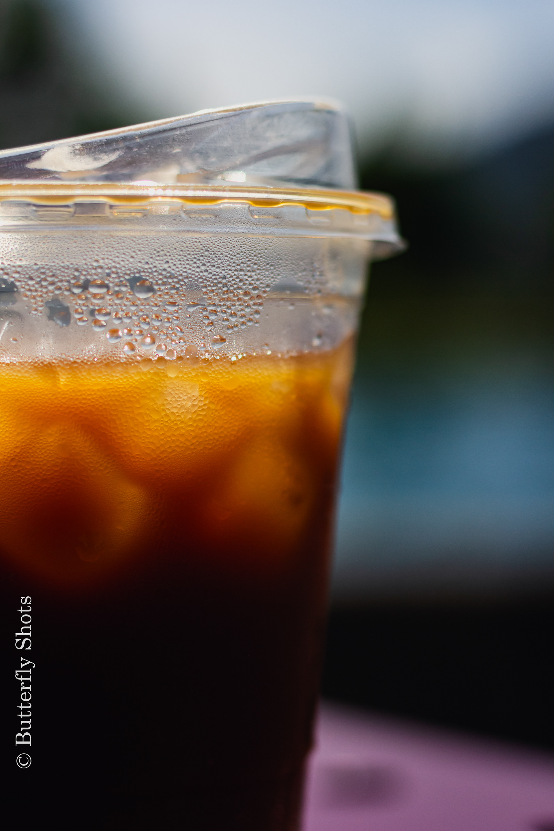 Product photography of a iced coffee on a warm day