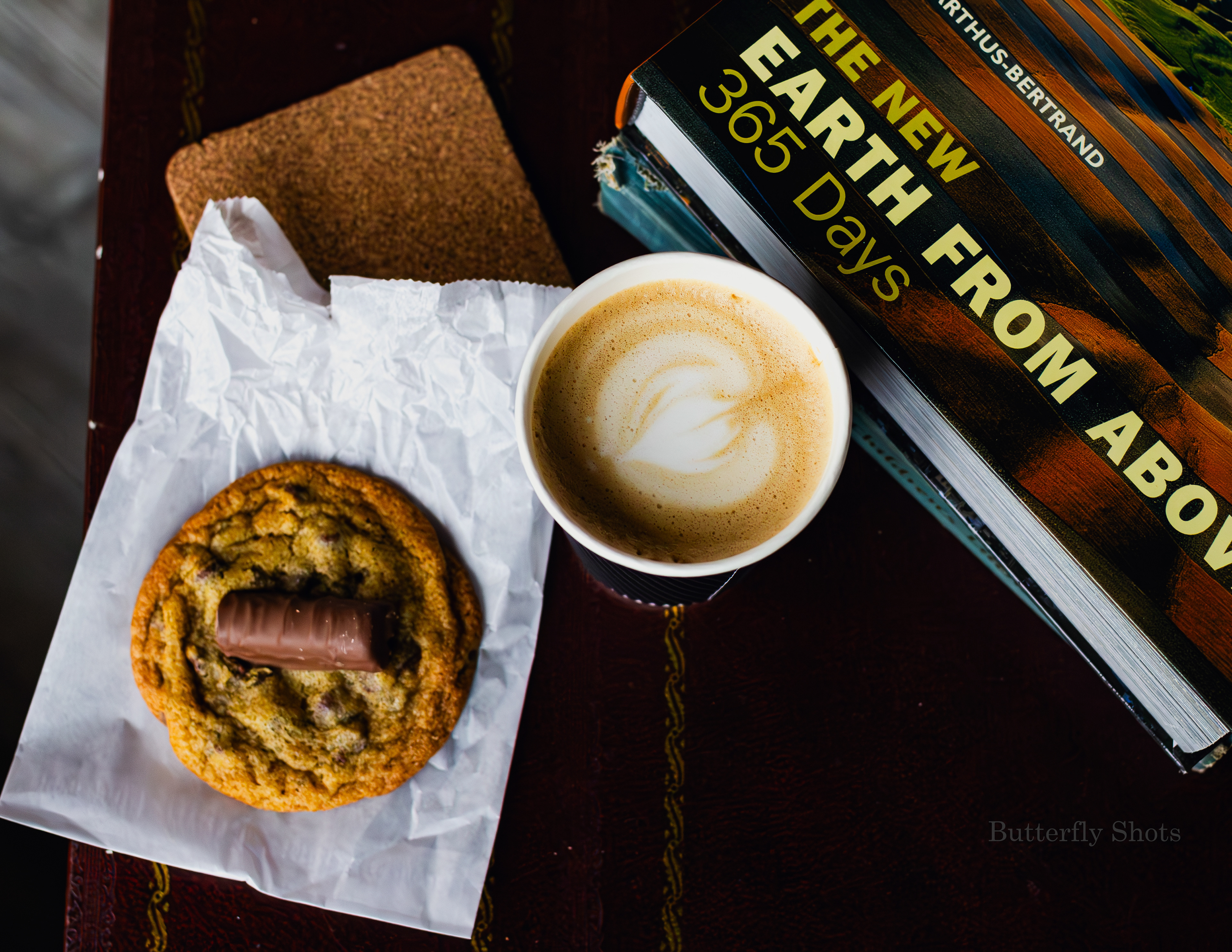 Product photography (food photography) of a latte coffee and a cookie