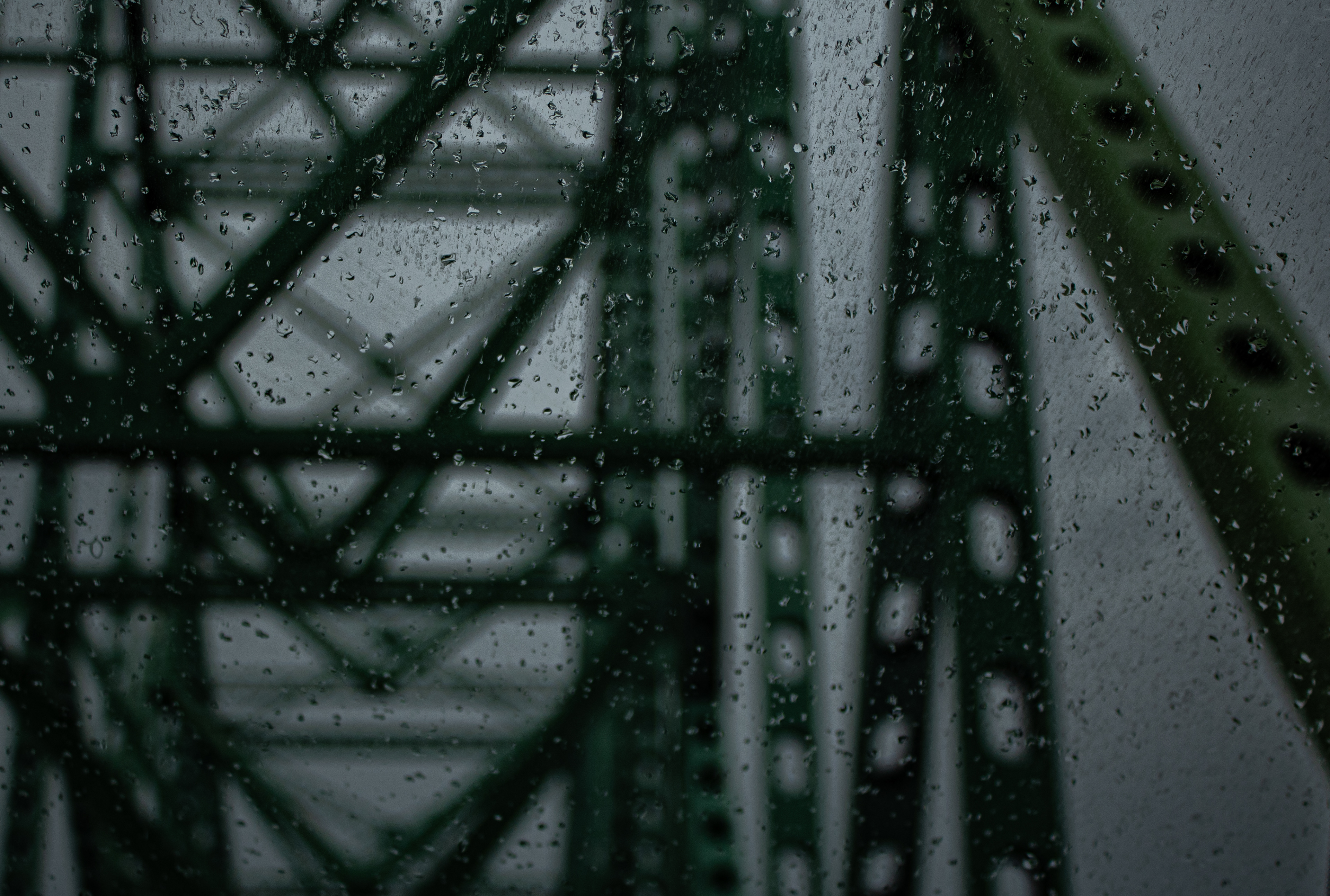 Street photography of the Van Horne Bridge through a windshield after rain