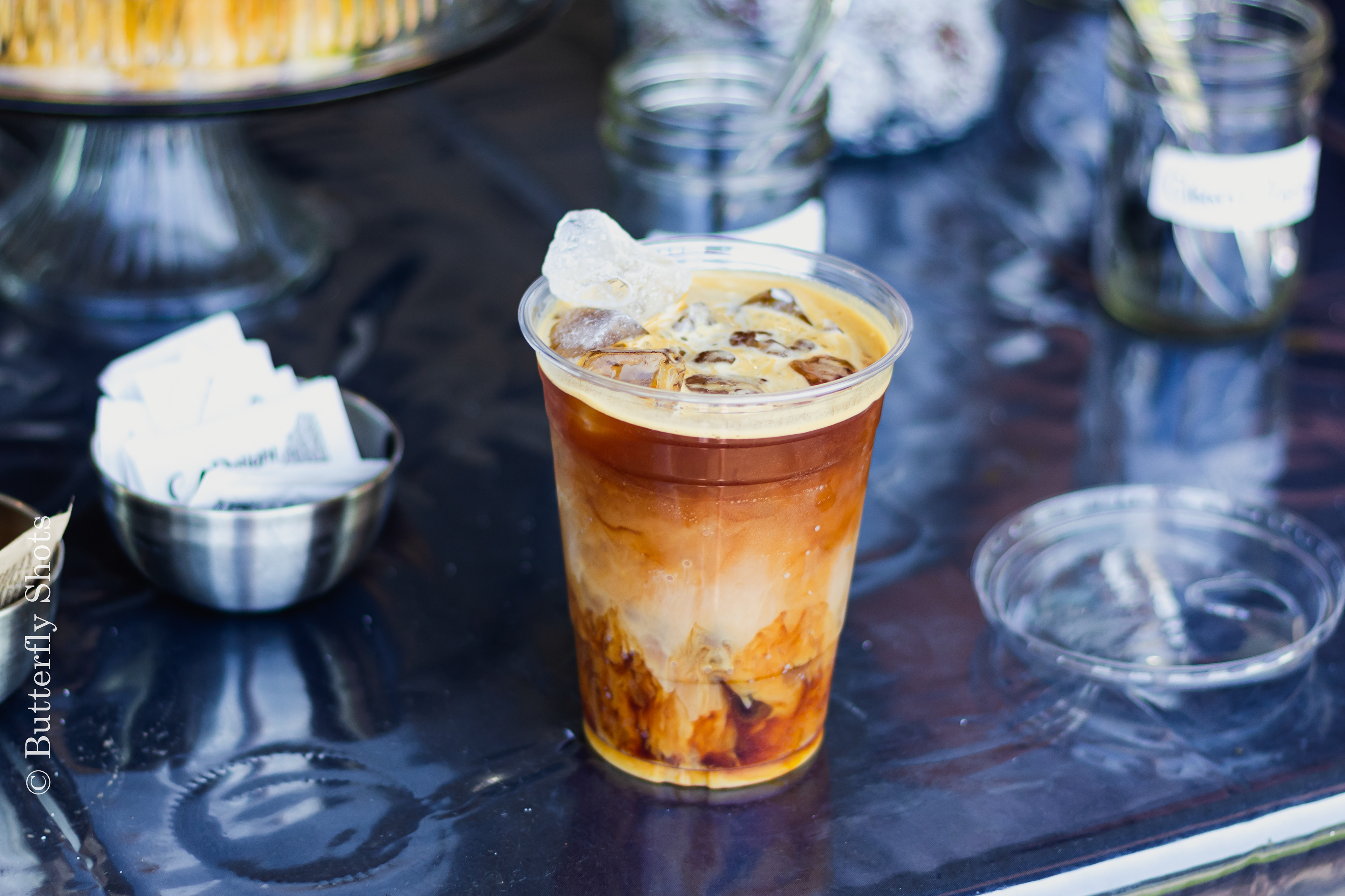 Product photography of a iced coffee on a warm day