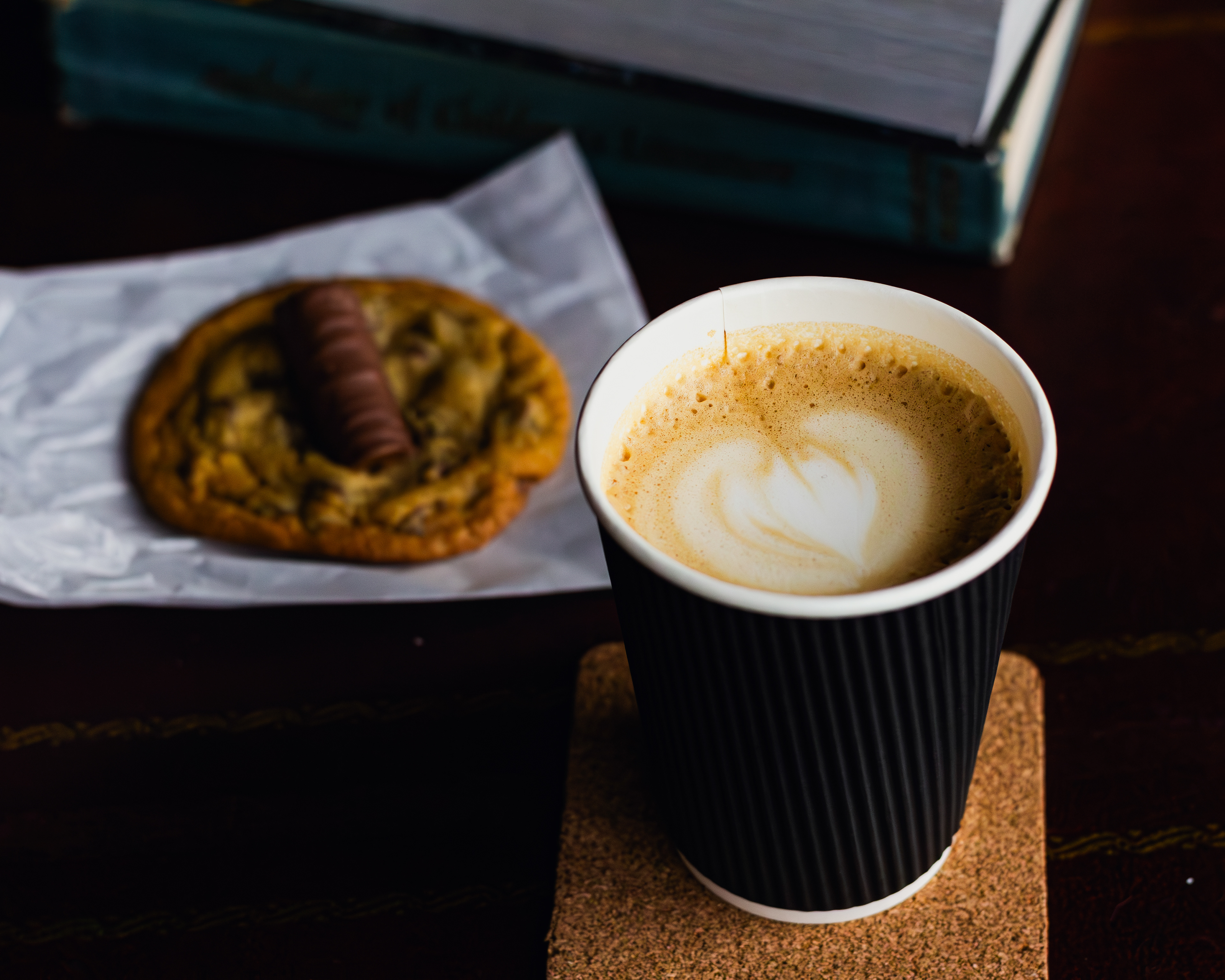 Product photography (food photography) of a latte coffee and a cookie