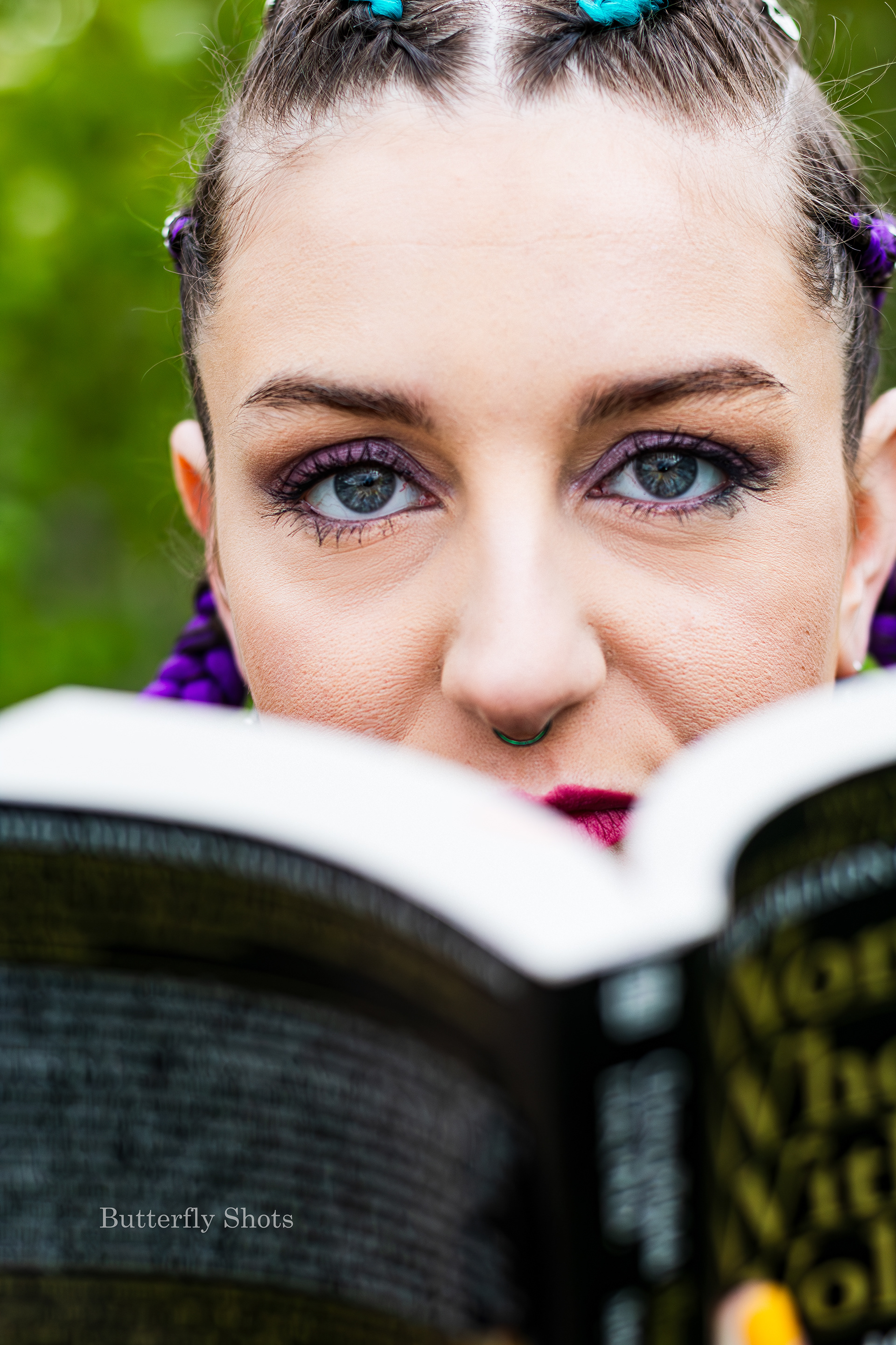Outdoors self-portrait with book