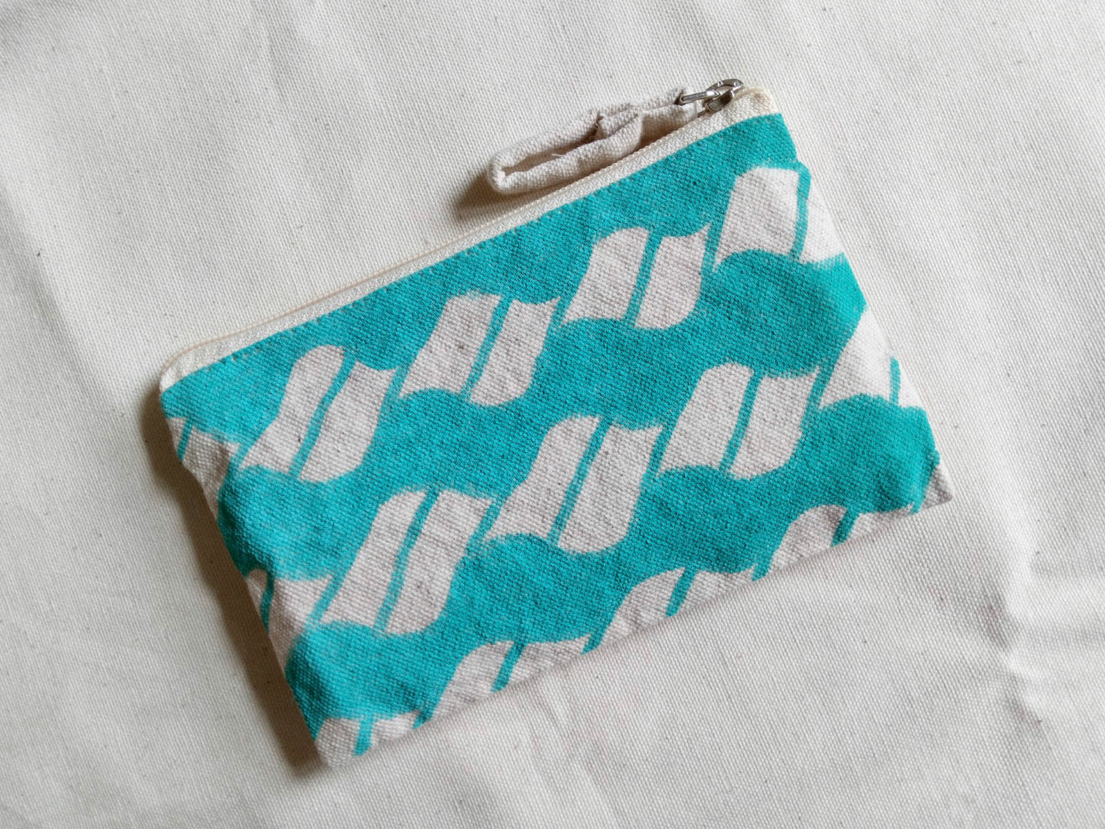 Tejado. A print inspired by the 'tejado' or red brick tile roofs in architecture scattered across the Americas. The waves serving as reminders of a colonial past forged by sea while also opening up room for reclamation, healing and new beginnings.