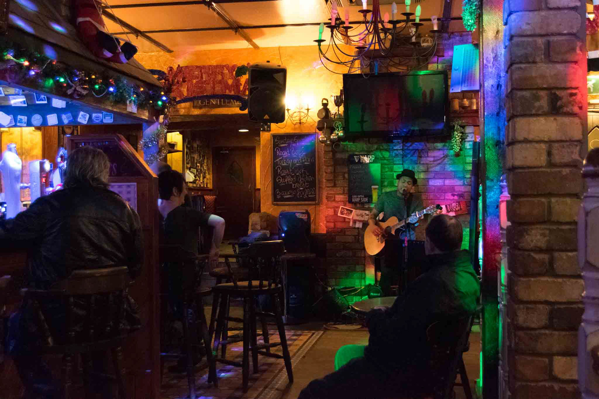 people in pub listening to music