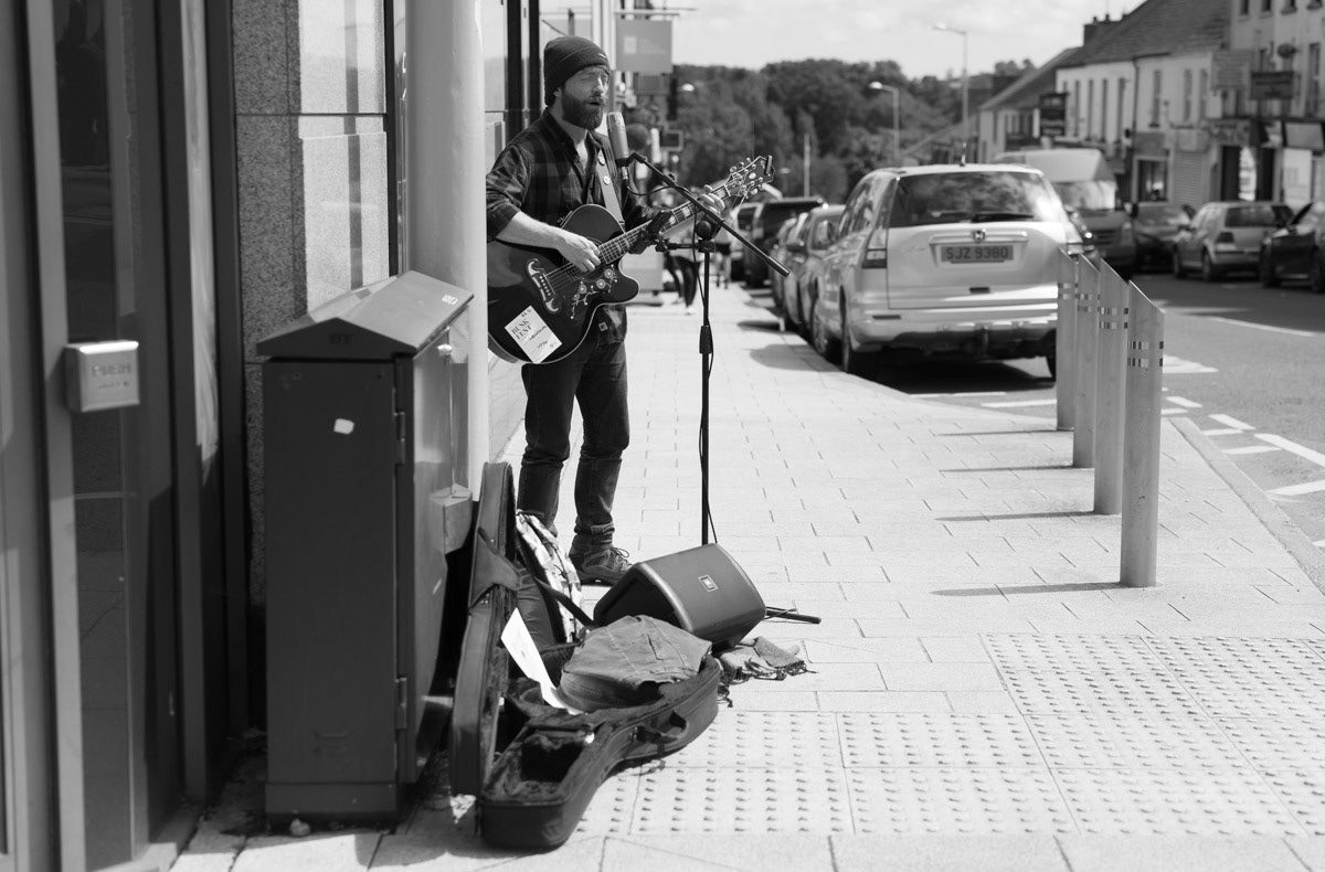 Budker playing guitar.