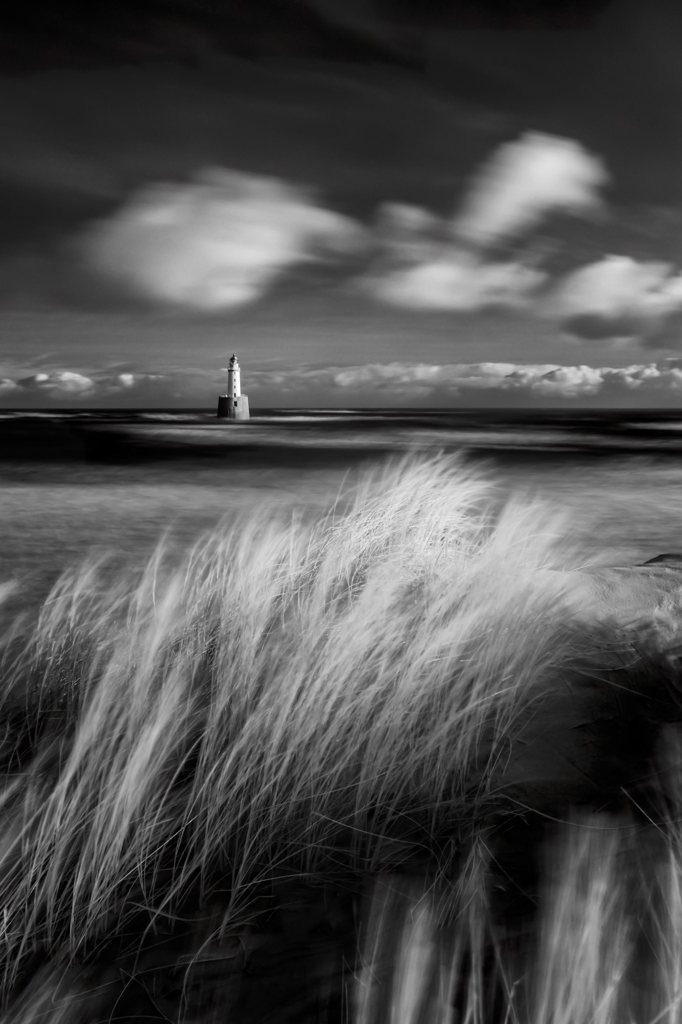 Rattray Head lighthouse stands off the north east coast of Aberdeenshire, Scotland