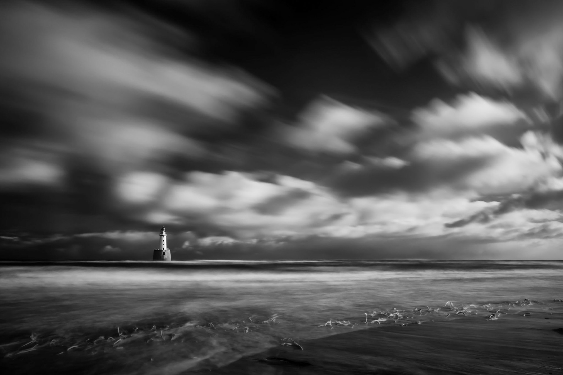 Rattray Head lighthouse stands off the north east coast of Aberdeenshire, Scotland