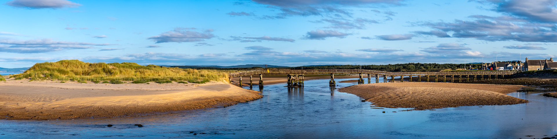 A panoramic view of the east beach and old footbridge in Lossiemouth, Moray, Scotland