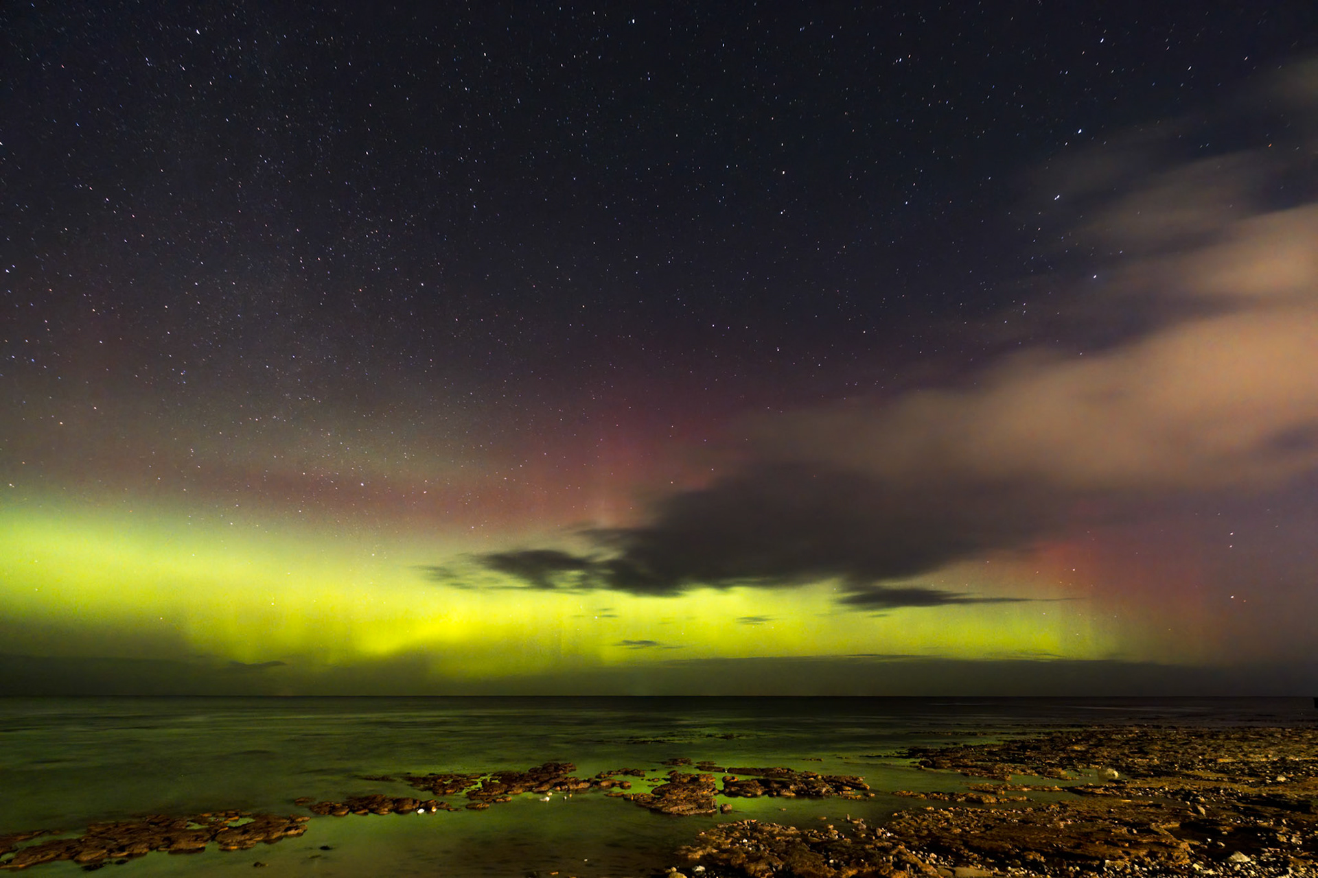 A display of the northern lights (aurora borealis), from the beach at Portgordon, Moray