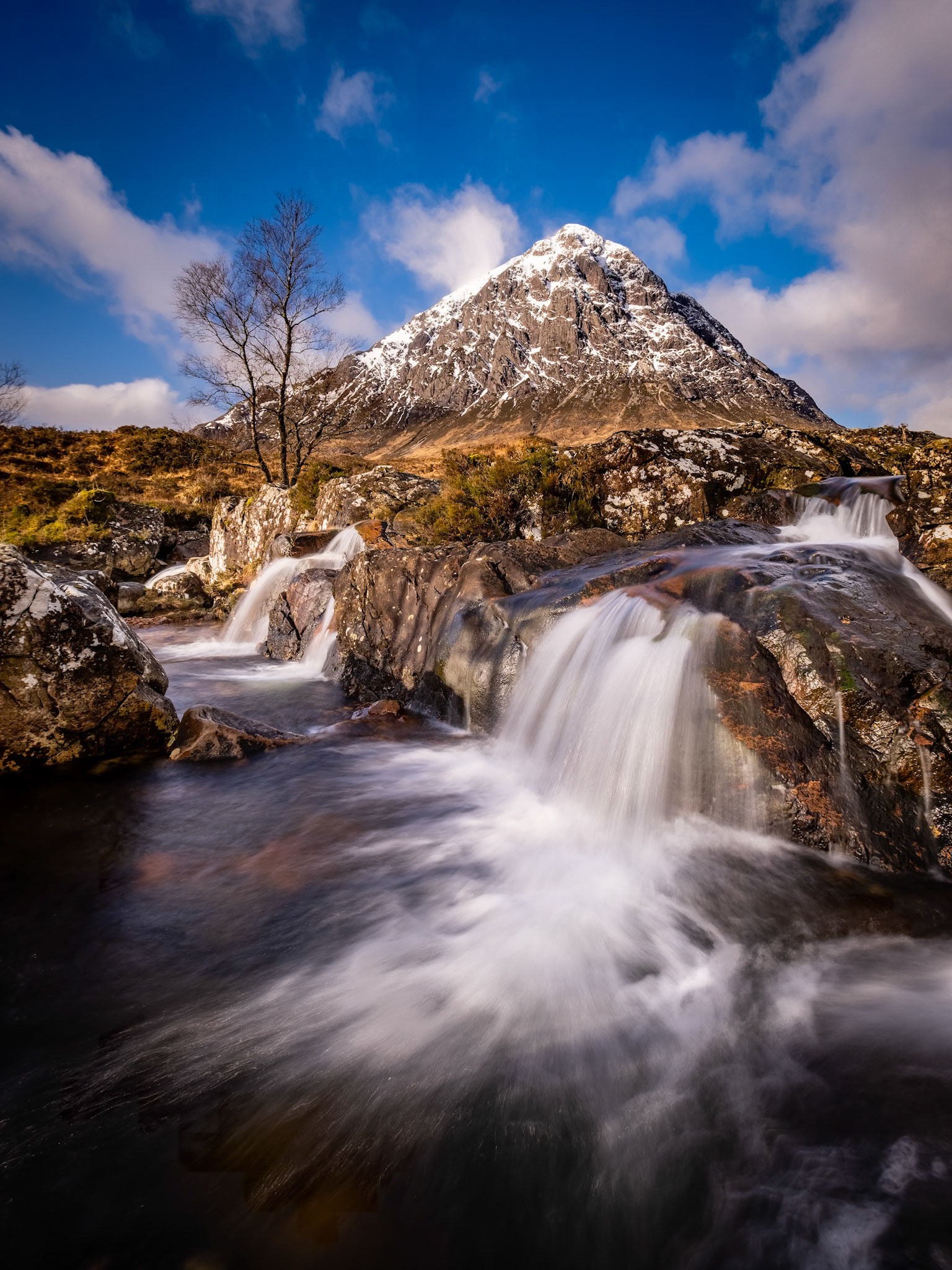 A view of Buachaille Etive Mor from the waterfalls on the River Coupall