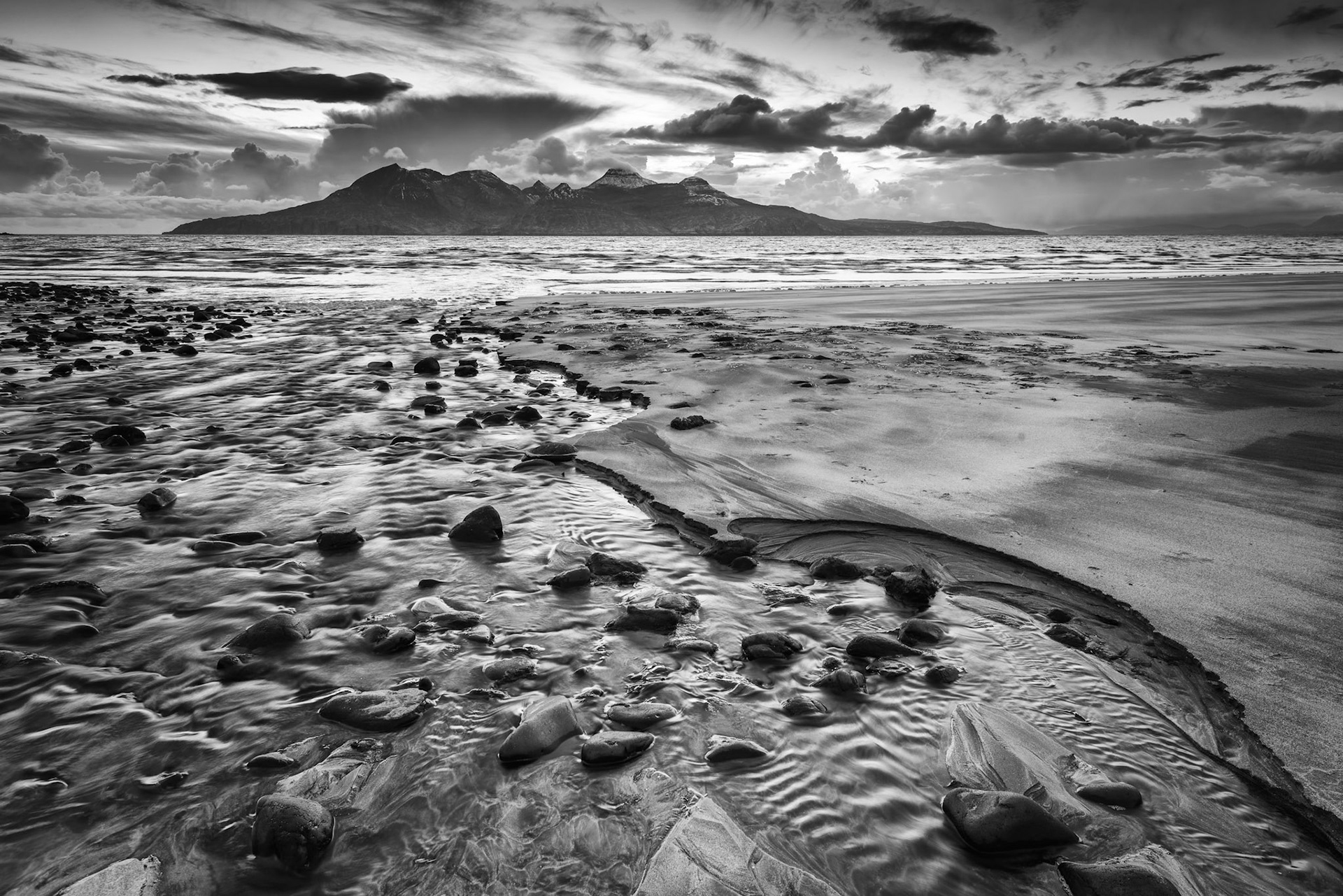 A view of the Isle of Rum, from Laig Bay on the Isle of Eigg, Scotland