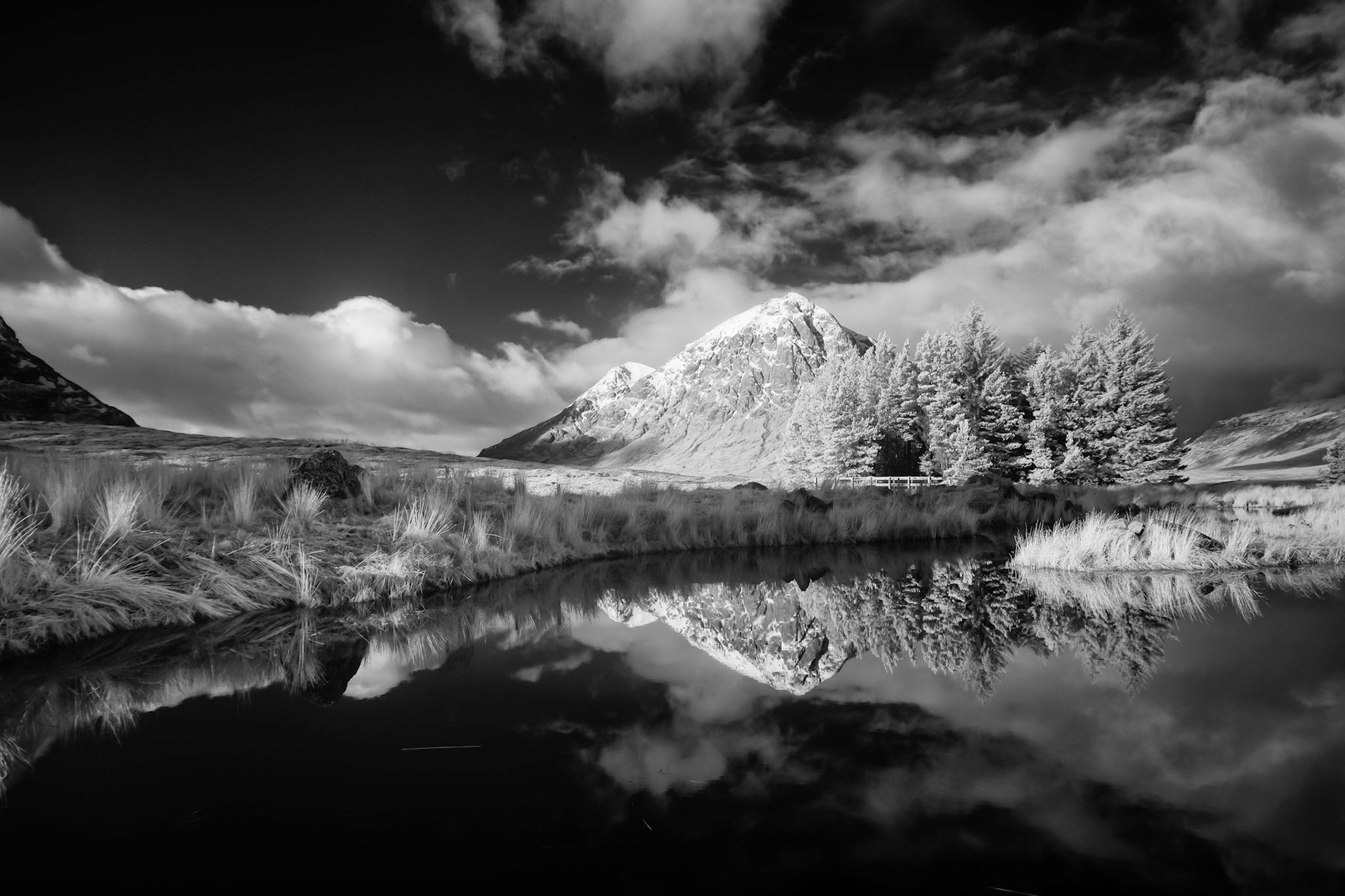 Buachaille Etive Mor in Glen Coe, Scotland, reflected in the pond at the Kingshouse Hotel