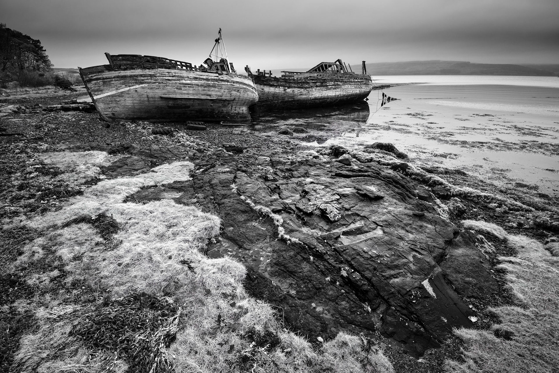 A pair of abandoned fishing boats on the beach at Salen, Isle of Mull