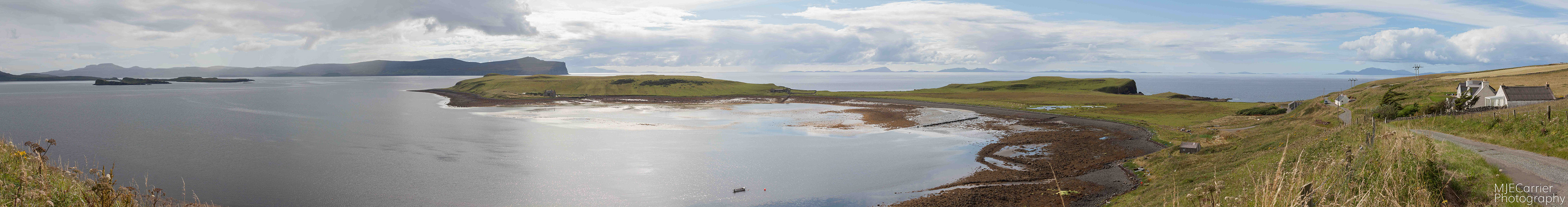 A mega-wide panorama from Trumpan on Skye with the Outer Hebrides in the far distance