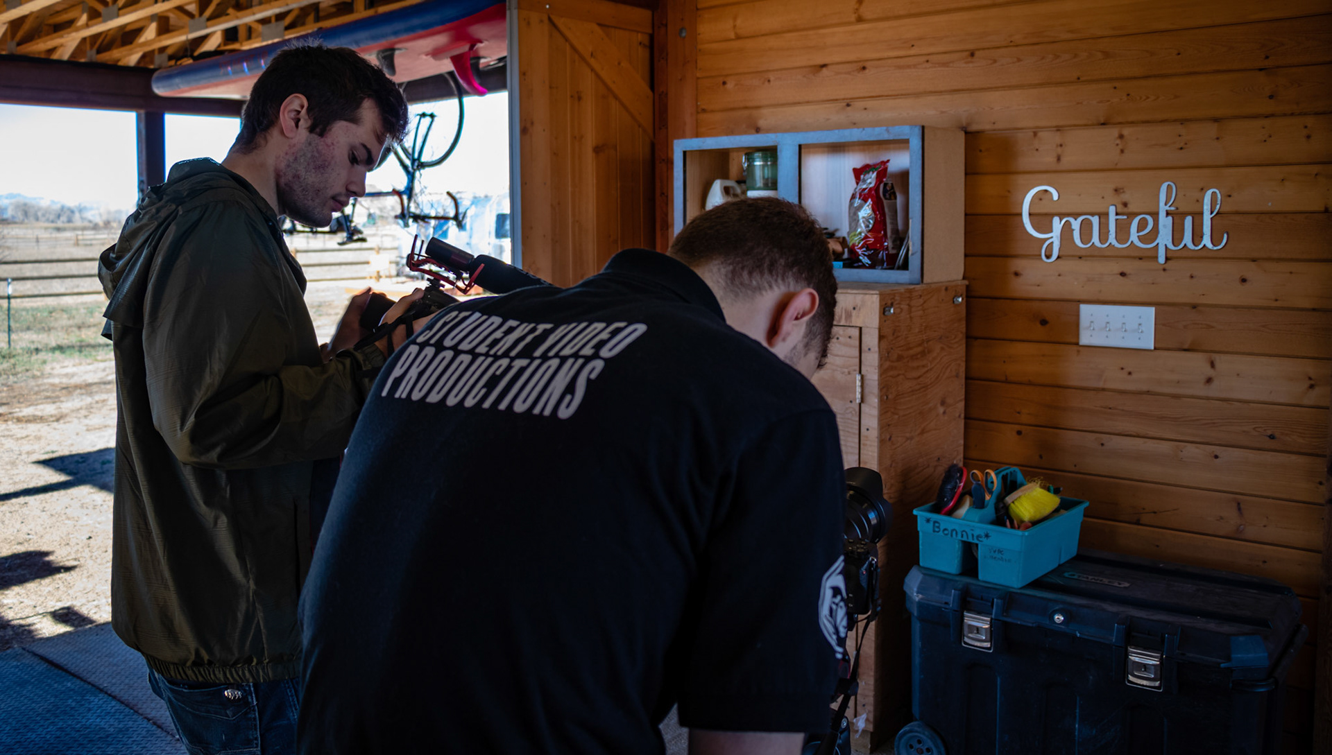 This image showcases Student Video Productions hard at work during a corporate video shoot for a house renovation company.