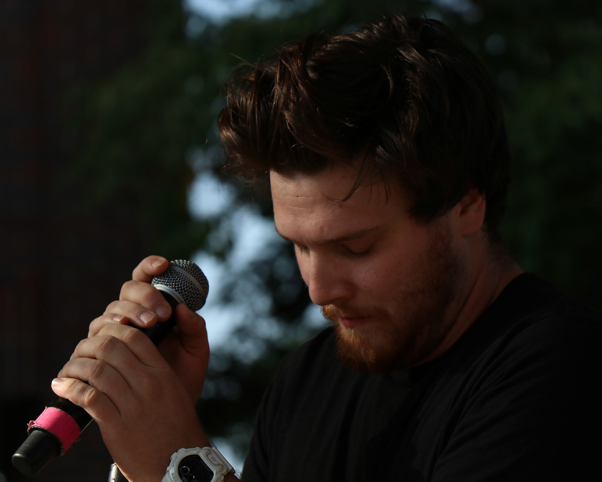 Sam Mourton stands tranquil during Write Minded's Performance during the 2018 Harvest Fest in Fort Collins, Colo.