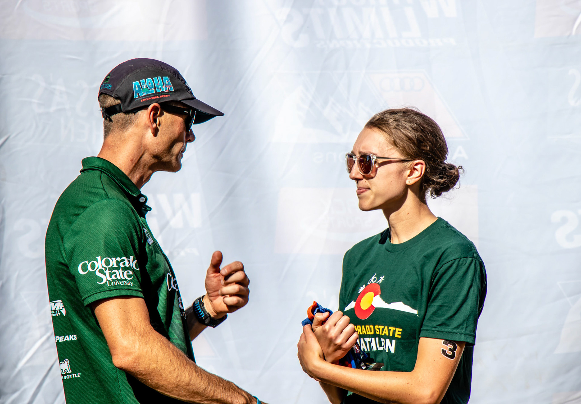 Colorado State Triathlon Head Coach Jon Mason and Megan Cooney talking tactics before the 2018 Oktoberfest Triathlon in Longmont Colo.