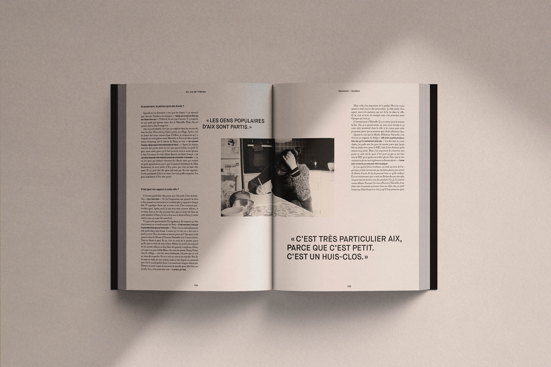 Opened book on one of the interviews with photo, text and quote