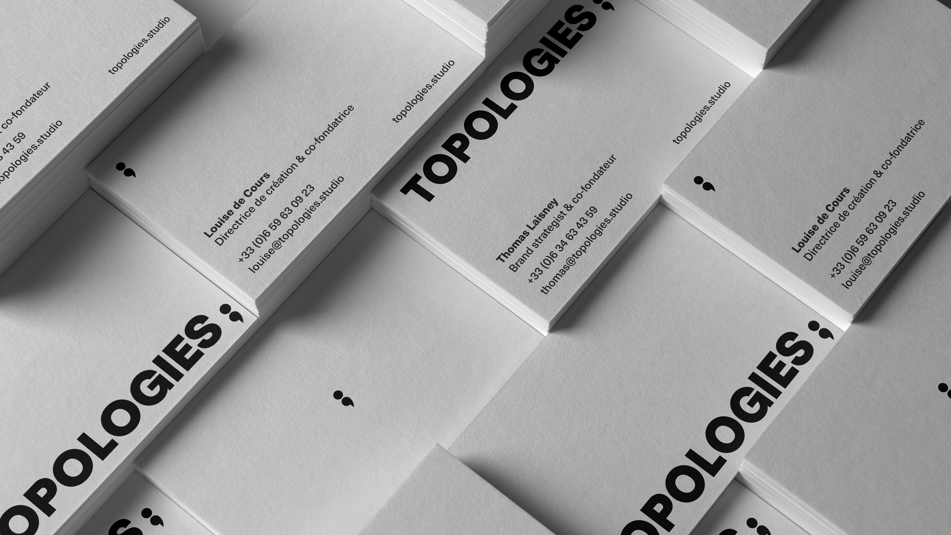 Front & back black & white business cards with logo, brand symbol and contact infos
