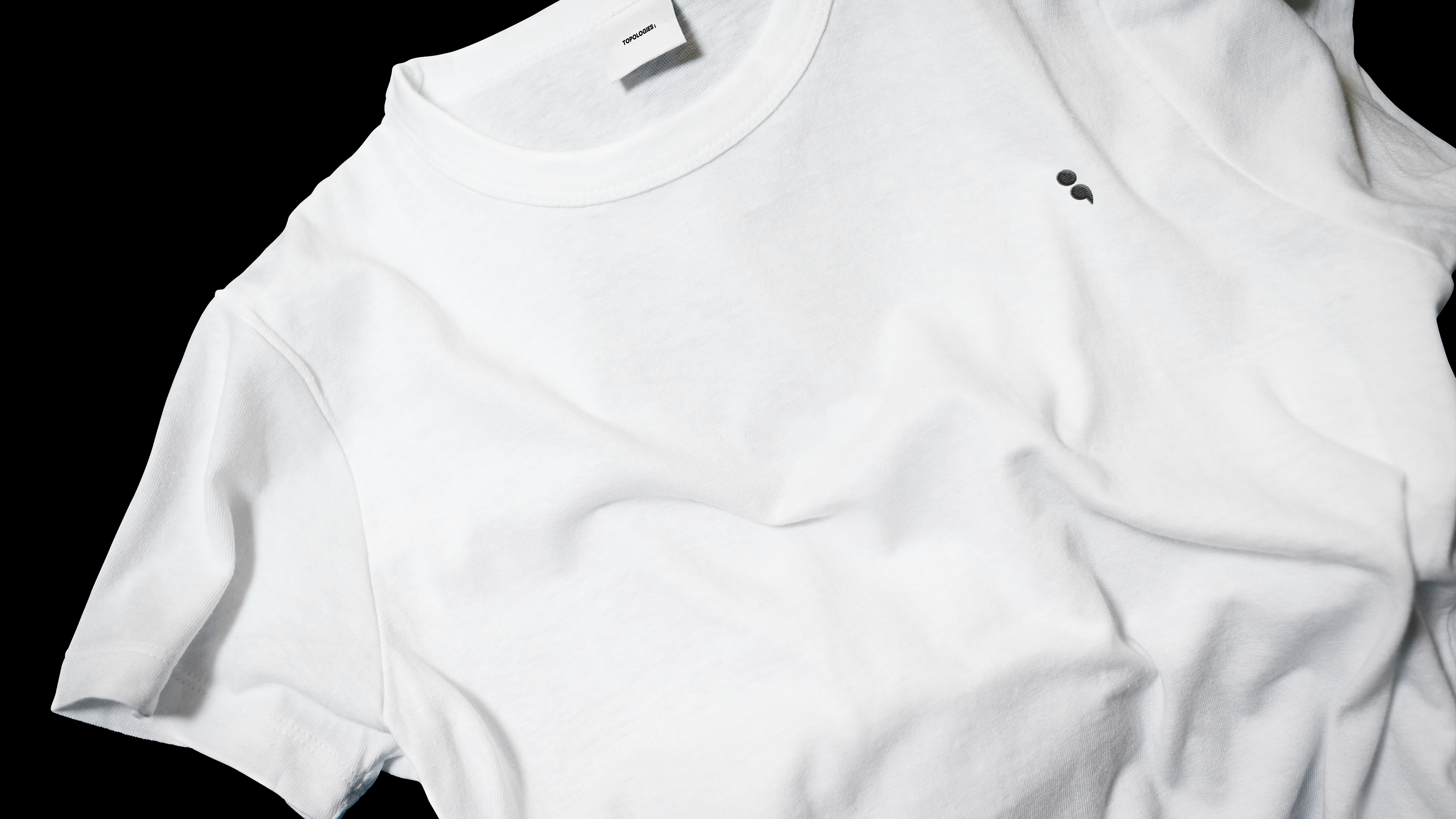White t-shirt with embroidered brand symbol
