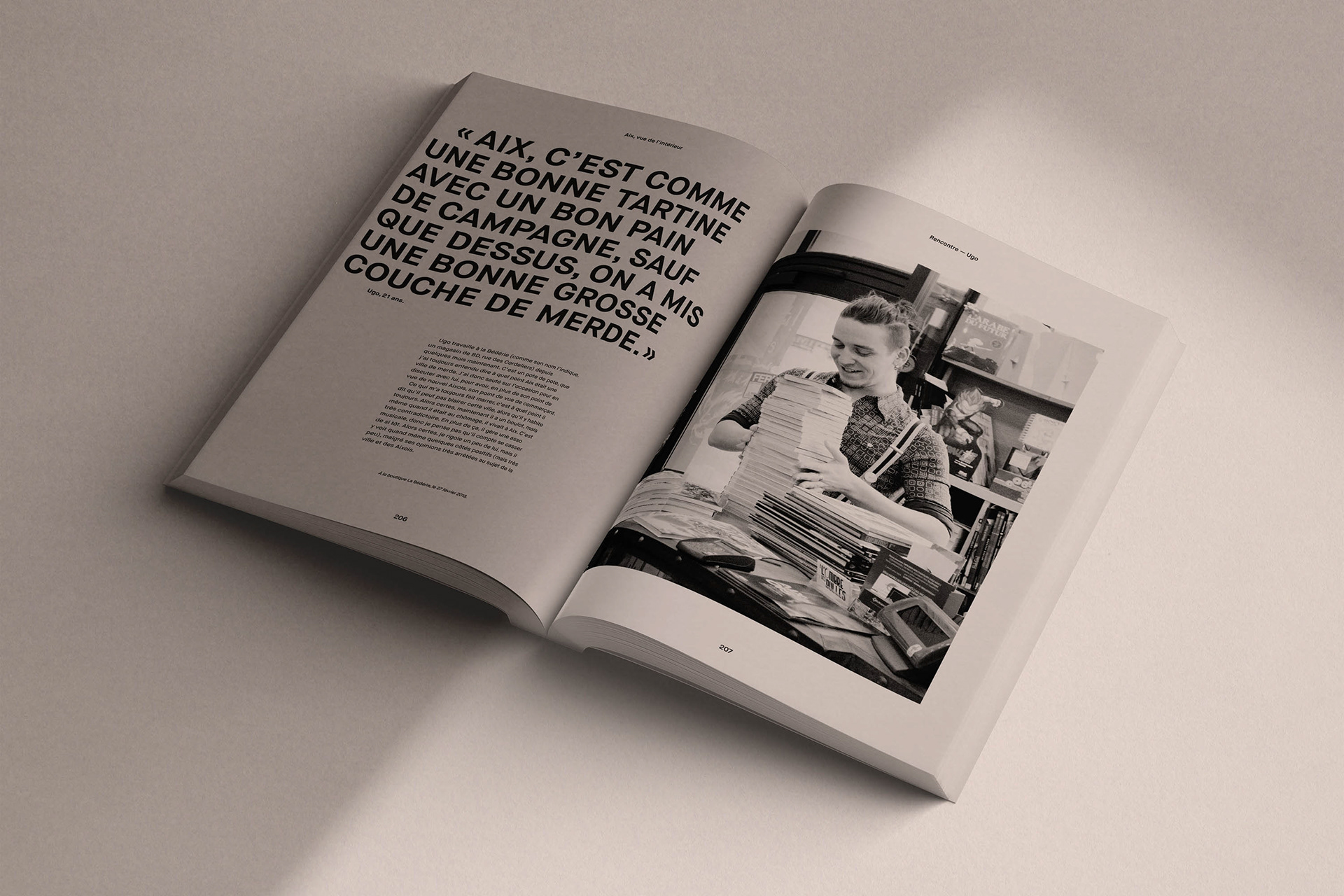 Opened book on one of the interviews with photo, text and quote