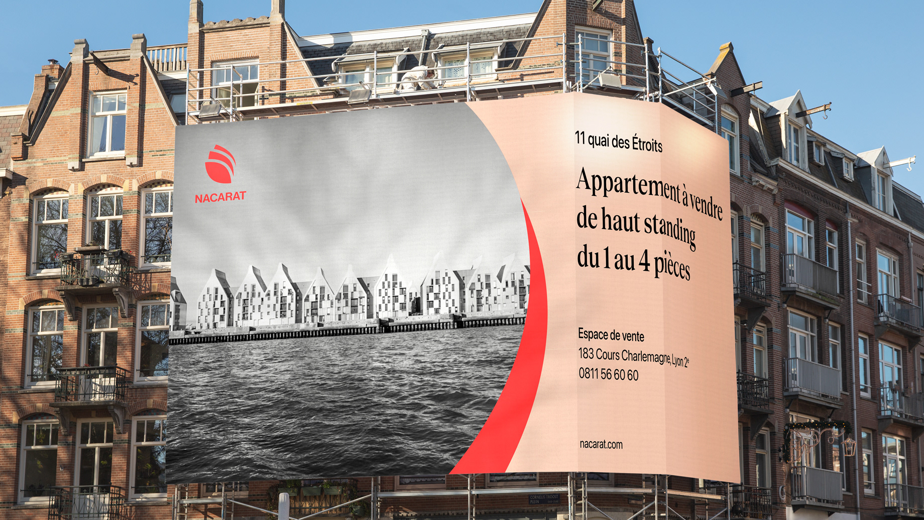 Tarpaulin on a scaffold with a black and white image of apartments made by Nacarat, on a beige background with black text and red Nacarat logo