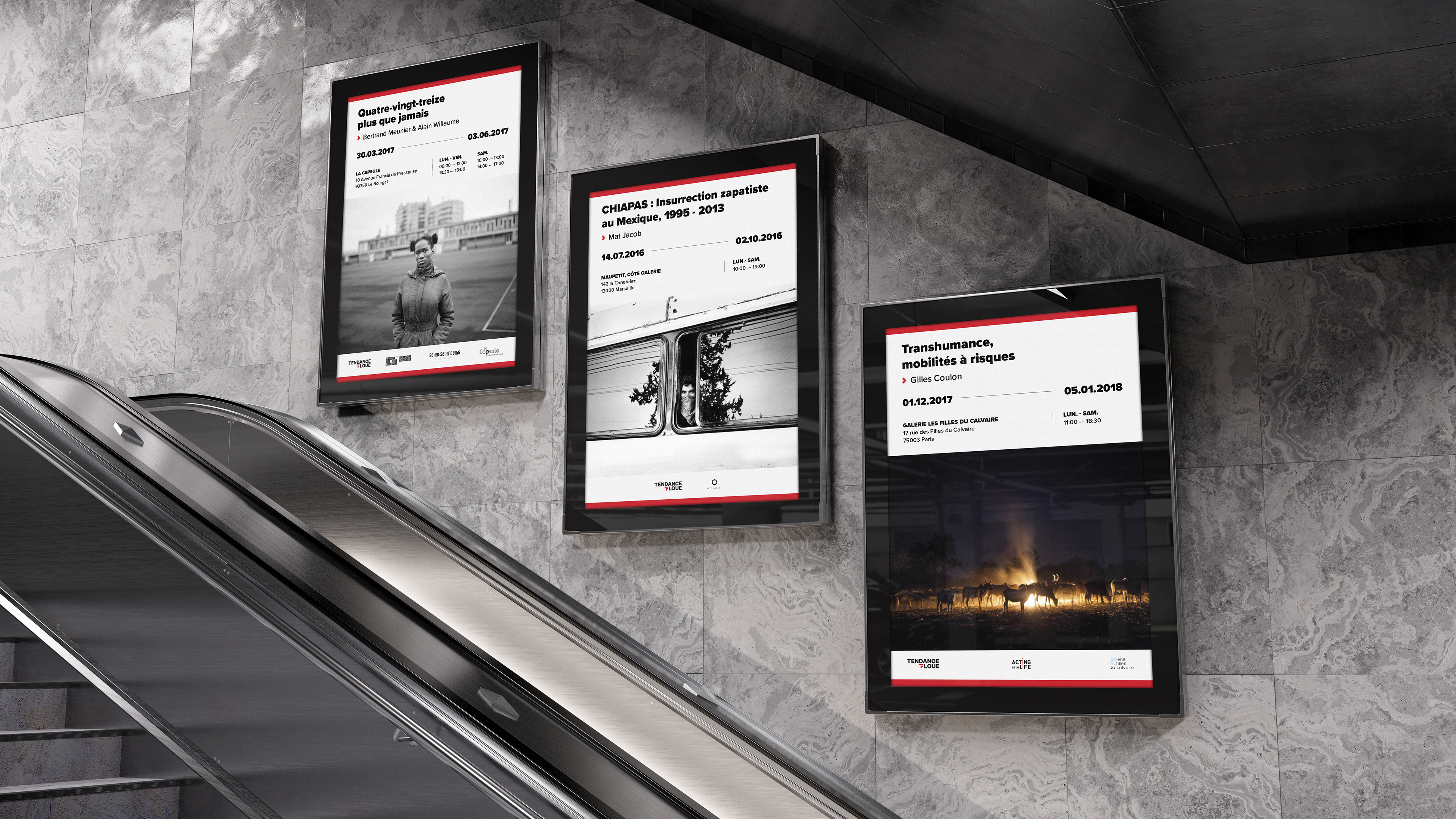 Three exhibition posters one after the other in a subway corridor