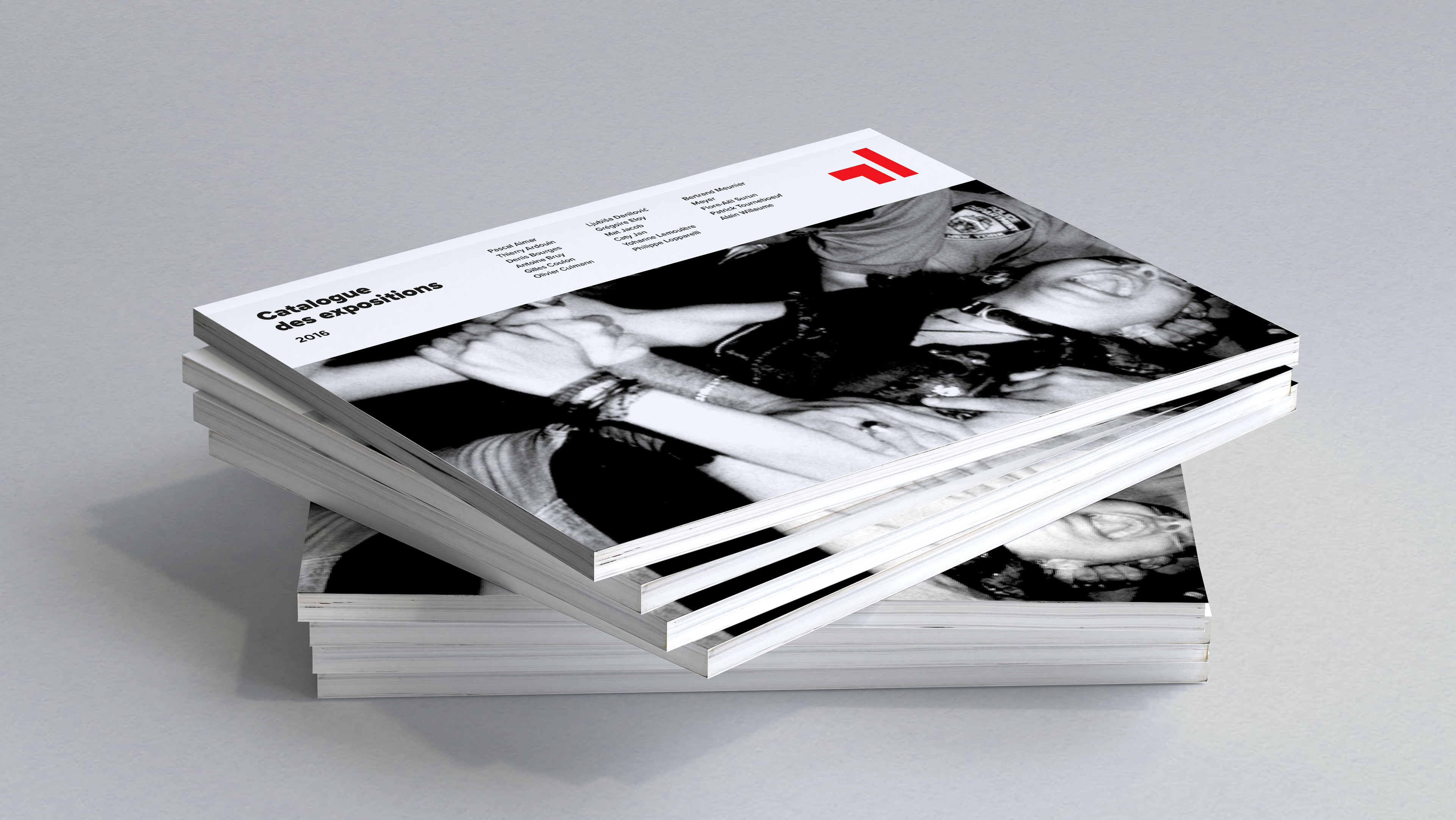Side view of stacked exhibition catalogs