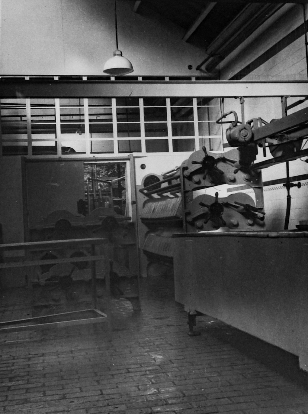 1950's Rowsley Dairy Cheese Press room. (Courtesy Derbyshire Record Office, donated in March 1985; they had previously belonged to the donor's father, who was an electrical engineer with the dairy.)