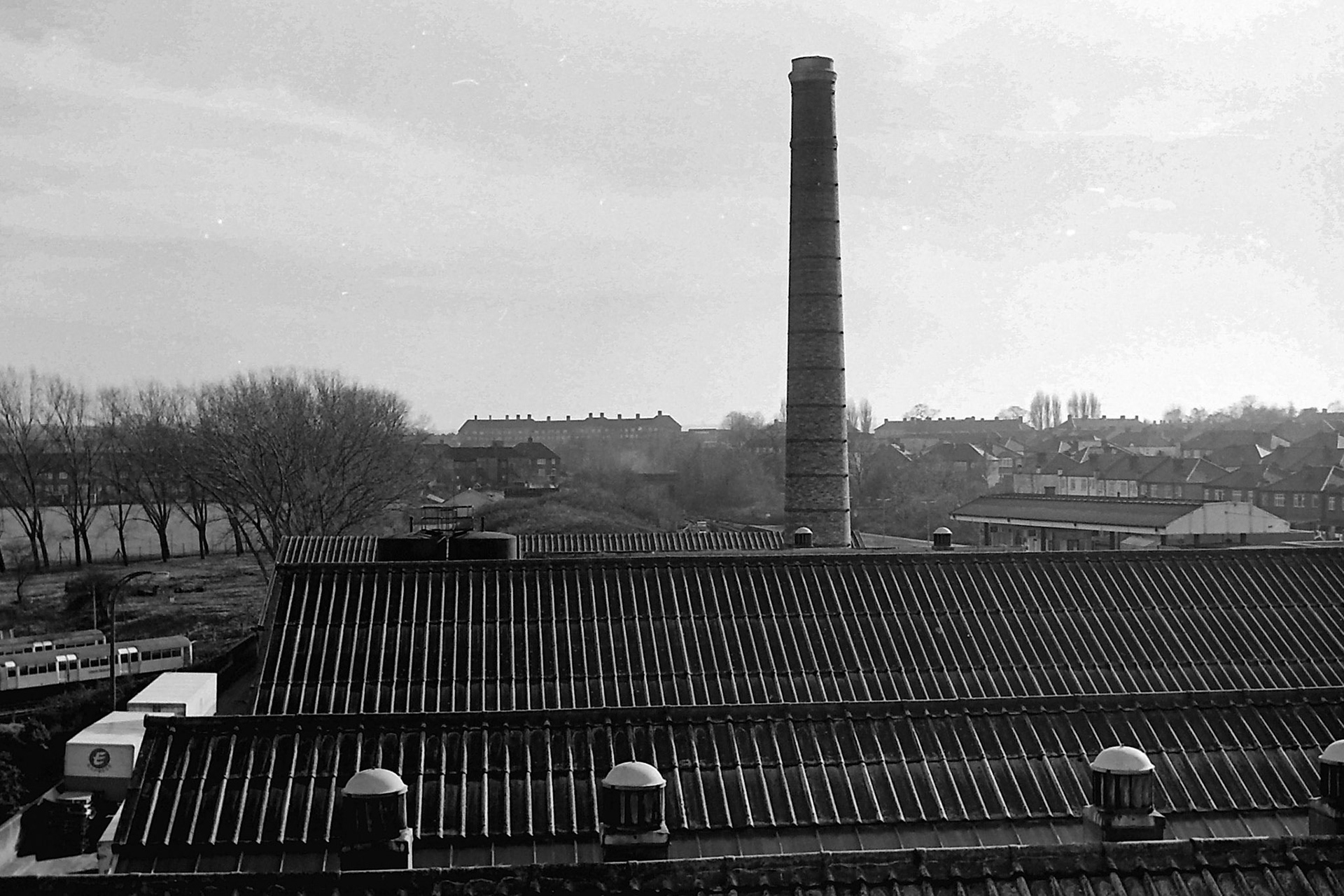 1979 View looking South from South Morden Dairy roof, with the old boiler chimney yet to be demolished. (Photographer Sam Jones)