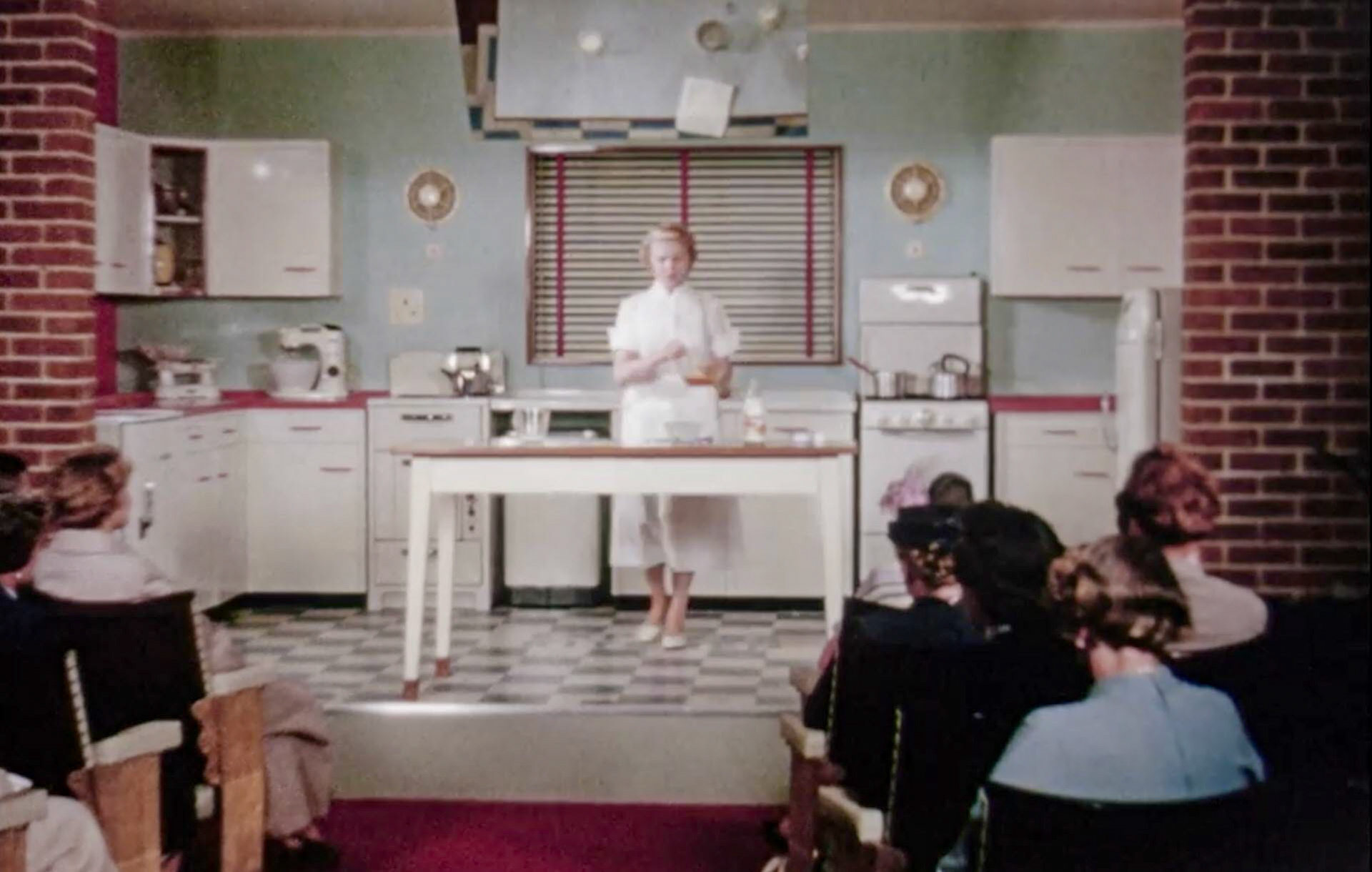 1954 South Morden Processing-visitors' room and demonstration kitchen, next to the laboratory and accessed from the mezzanine viewing gallery. (Stills from Express Dairy Film)