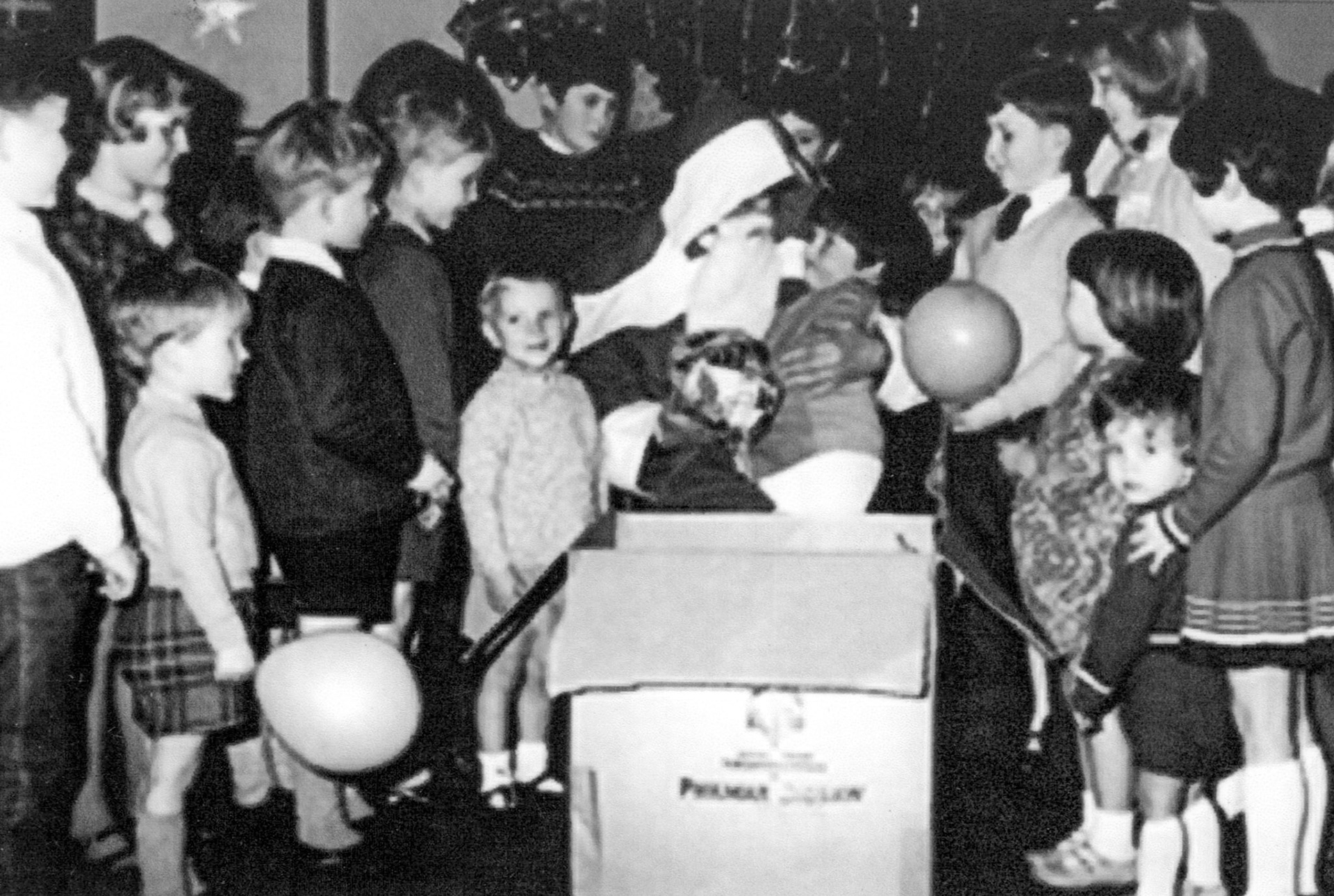 1969 Honiton. Debbie New comments "This is a photo taken at the Turks Head in Honiton. I am the girl on the far right of the picture holding onto my younger brother David Thatcher. It was probably around 1969. Anne Langfield adds "I think me and Alan are on opposite side from you". Note: Keith Sweetland commented "Whitford village hall".