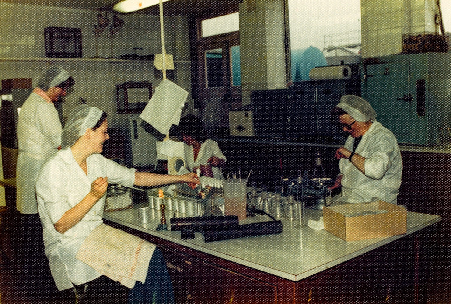 1980's? Minsterley Laboratory. Kenneth Carswell identifies Barbara Carswell seated with pipette. Ben Samuels adds "Carol Lewis on the left". Debbie Llewellen comments "The lady sitting down is Mitch Philpott, she was the supervisor when I first started in the lab. I would have been only 16 or 17 years old then." (Joe Lyons Collection)
