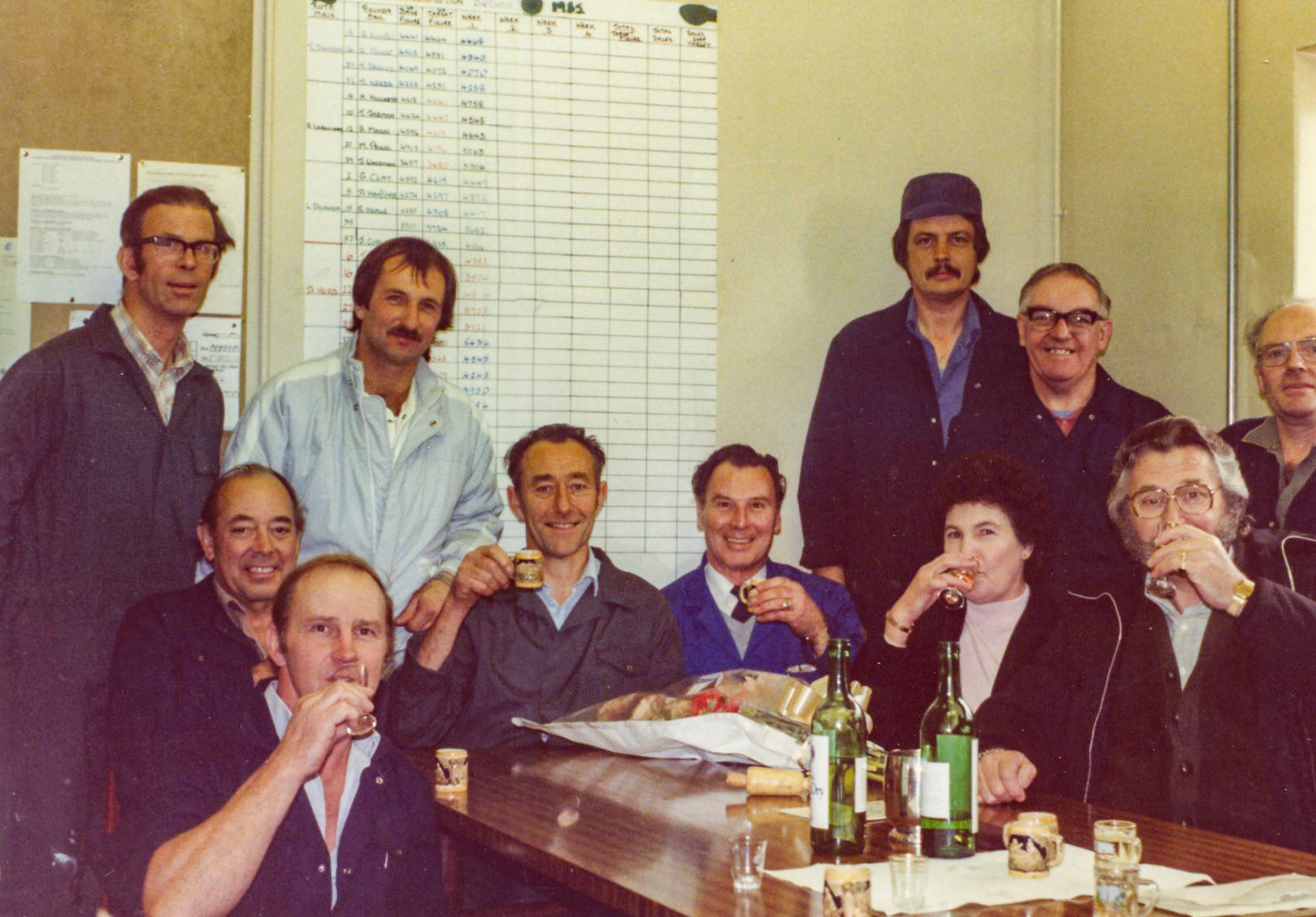 1980's Exeter. Jimmy Reid and Sally-Anne Long identify L to R standing: Andrew Taylor, Melvin Walrond, Tony Sinclair, Harry Wood and Bob Phillips. Sitting: Dave Ashley, Dave Ashley, Dougie Martin, Colin White, Dick Stroud, Mrs. Perry and Peter Perry.  Wendy Lyne-Ley commented "Dick Stroud-my dad, I also worked in egg packing"  (Courtesy Phillip Budd)