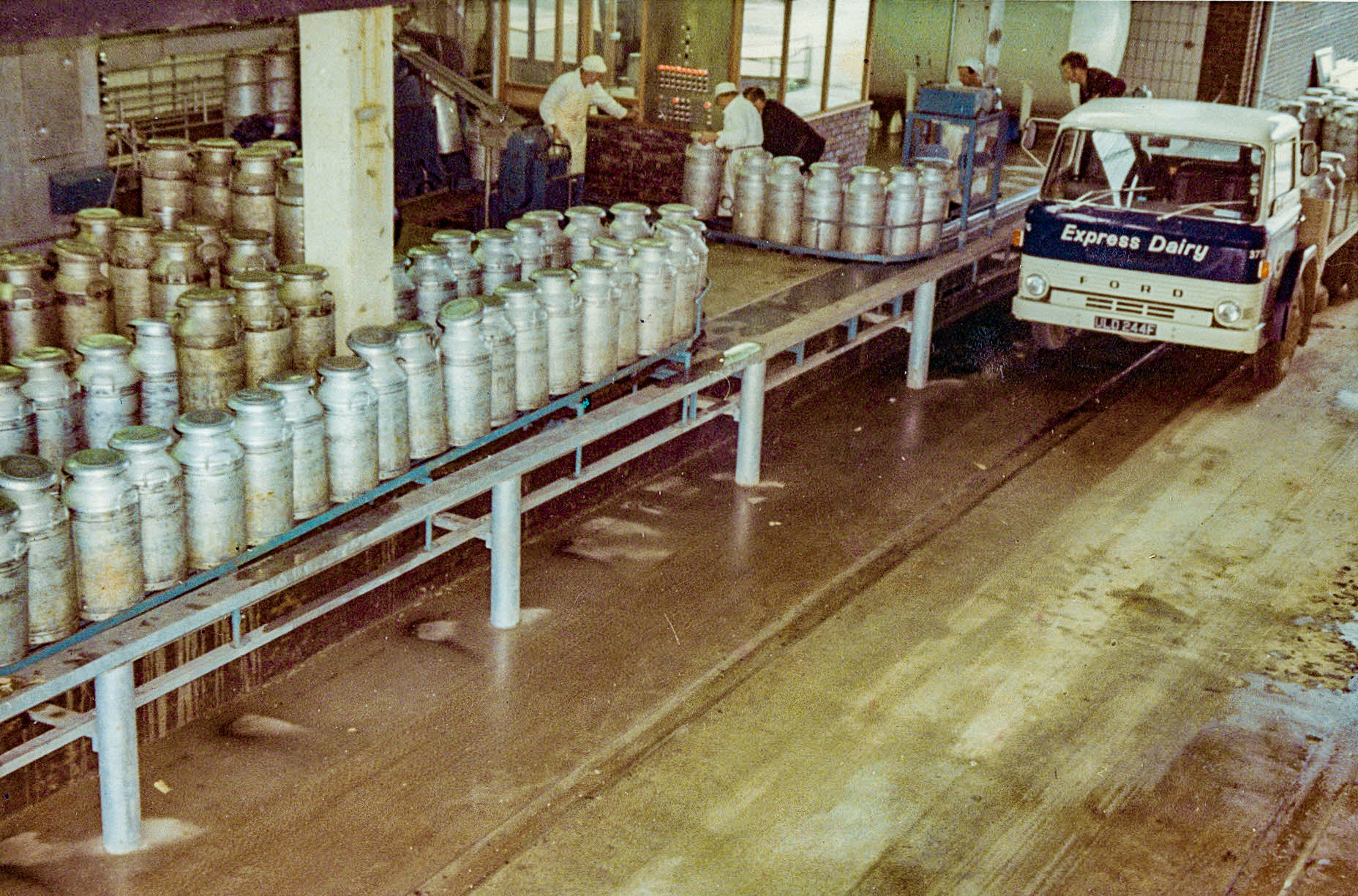1969, 1st April - Second churn truck unloading Ford ULD 244F, Co: 373. (From 'A Photographic Record of the Construction of the Creamery' by Bill Wilson (Courtesy Allhallows Museum, Honiton)