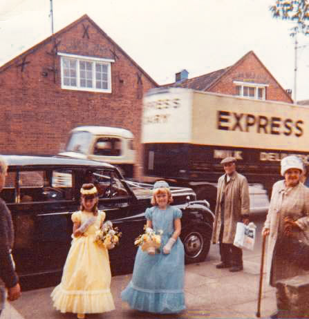 1950's David Ashby comments "Susan Grainger bridesmaid (in blue) at St Peters Church Cricklewood Lane"