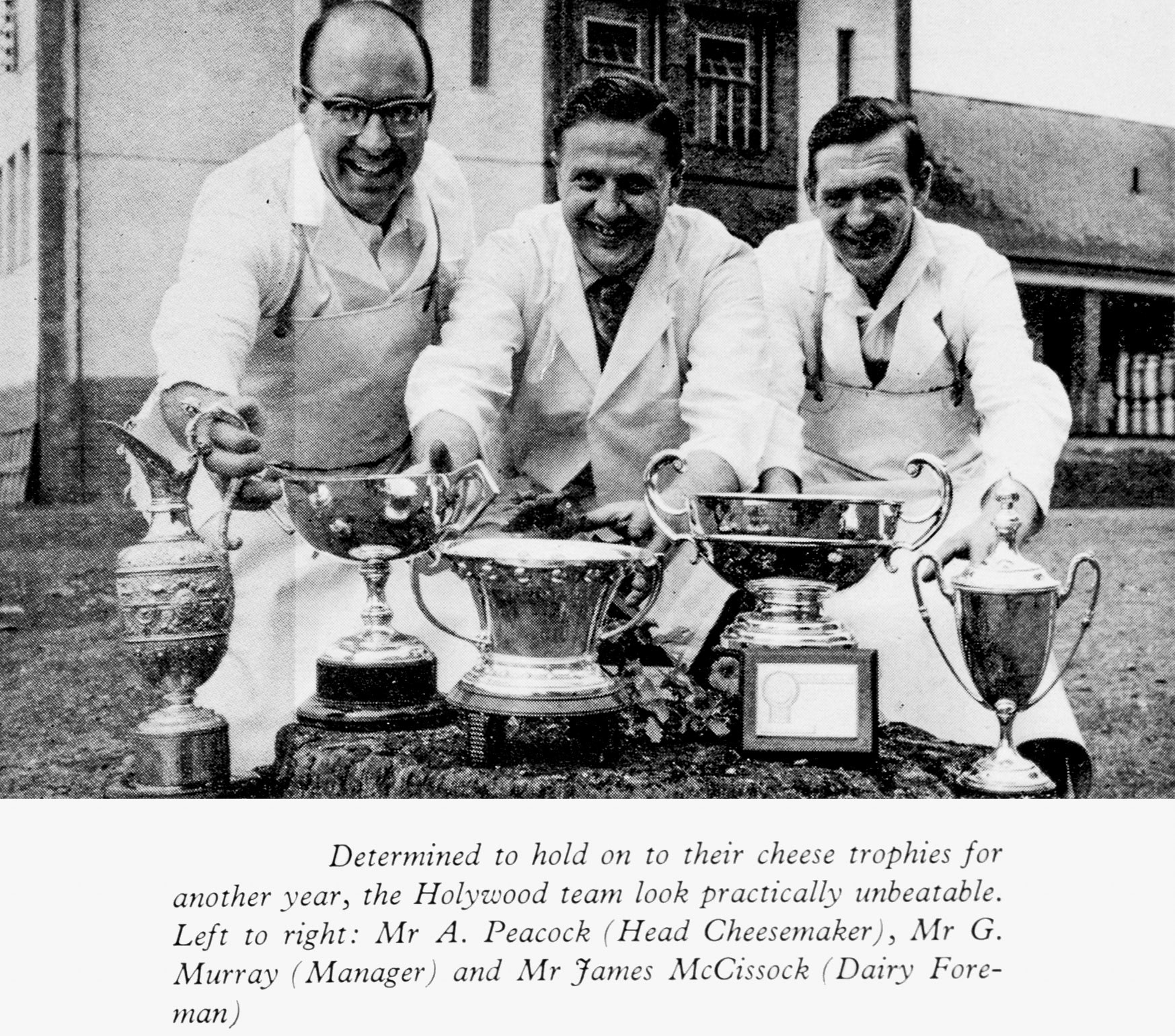 1961 Sanquhar cheese trophies held by Mr A. Peacock (Head Cheesemaker), Mr G. Murray (Manager) and Mr James McCissock (Dairy Foreman). (Express News Autumn)