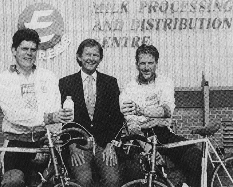 1989 Charity Bike Ride raises £7500, calling at Exeter Processing, where Paul Fewings and Tim Eden collected a cheque from Bob Pearce, Sales Admin Manager