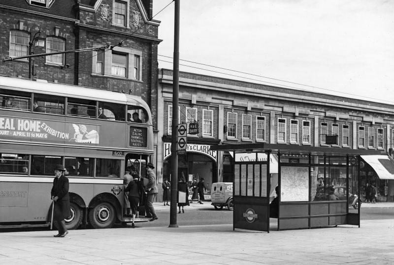 1939 Bus/coach roadside passenger shelter at the Granville Hotel, Uxbridge Road, Ealing Common, with Hornby & Clarke Dairy shop. (Courtesy London Transport Collection)