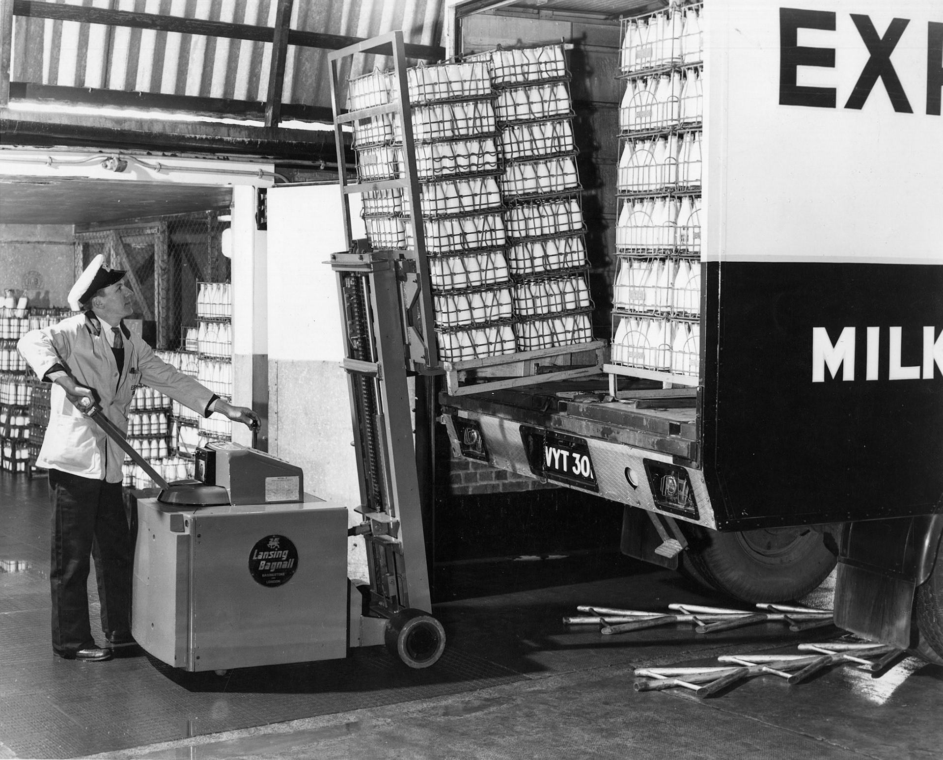 1959 April "Unloading by fork-lift at College Farm retail" Bedford TK, VYT30?  (Courtesy Dave Fane)
