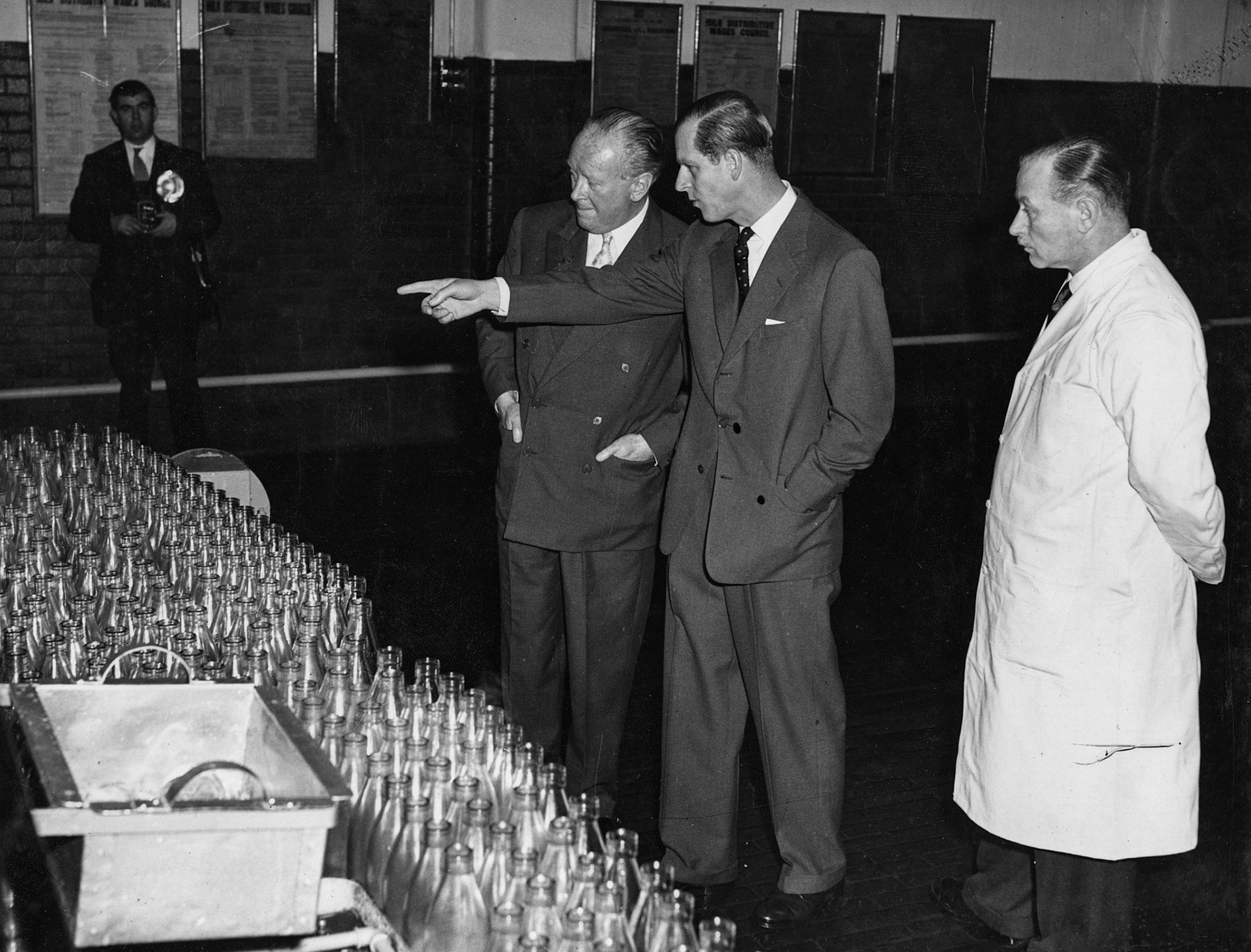 1957 South Morden-Duke of Edinburgh's visit on November 12-Mr L.W. McNair looks on as the Duke points to the bottle washer.  (Courtesy Paul Luke)